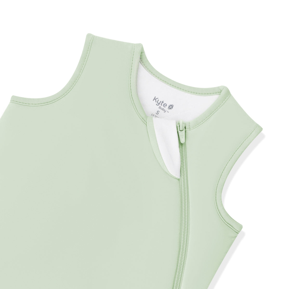 Close up of the zipper garage and top zipper on the Sleep Bag in Basil 1.0