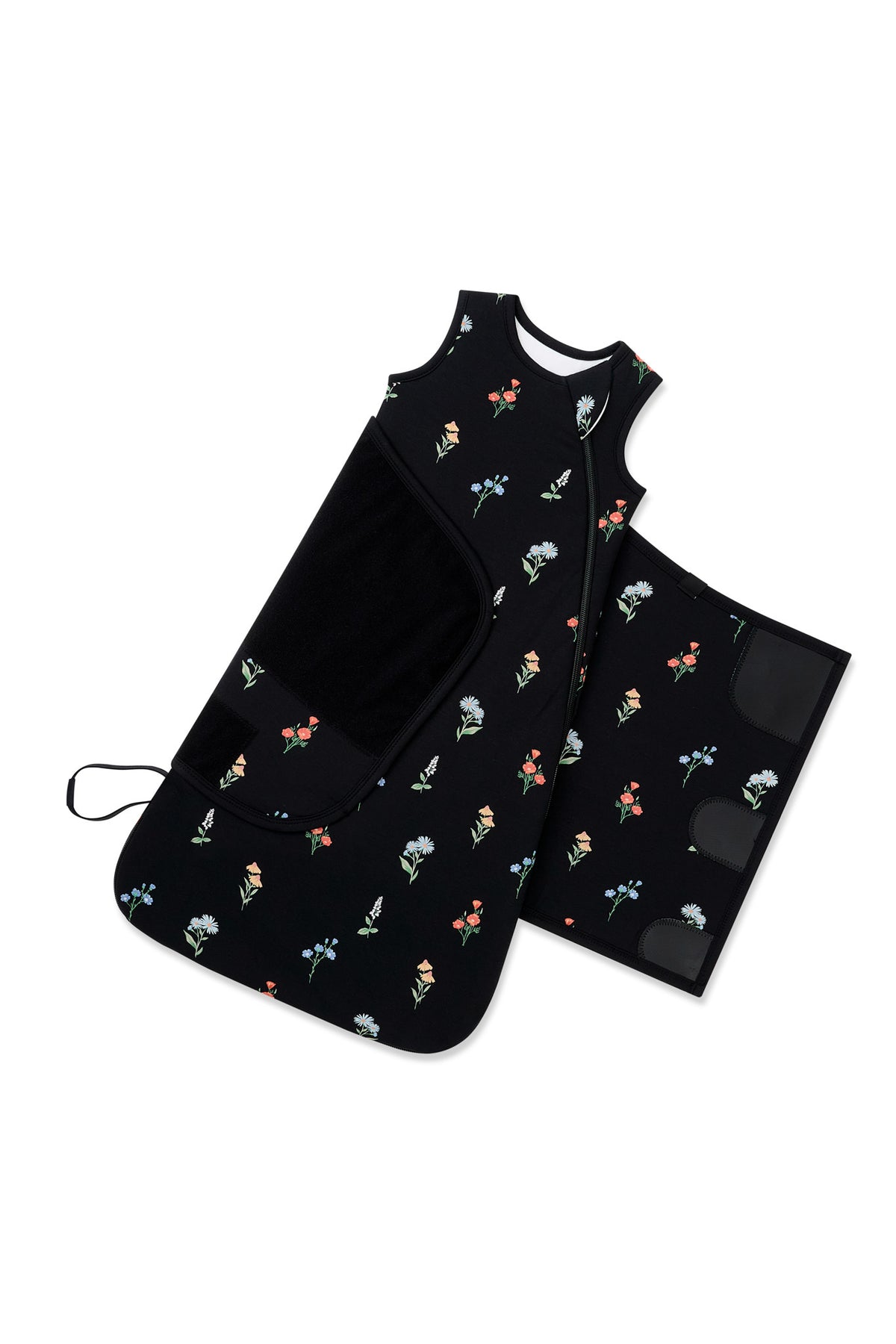 Adjustable velcro strap shown on an unswaddled Black Sleep Bag Swaddler in Wildflower 1.0 print on a white background
