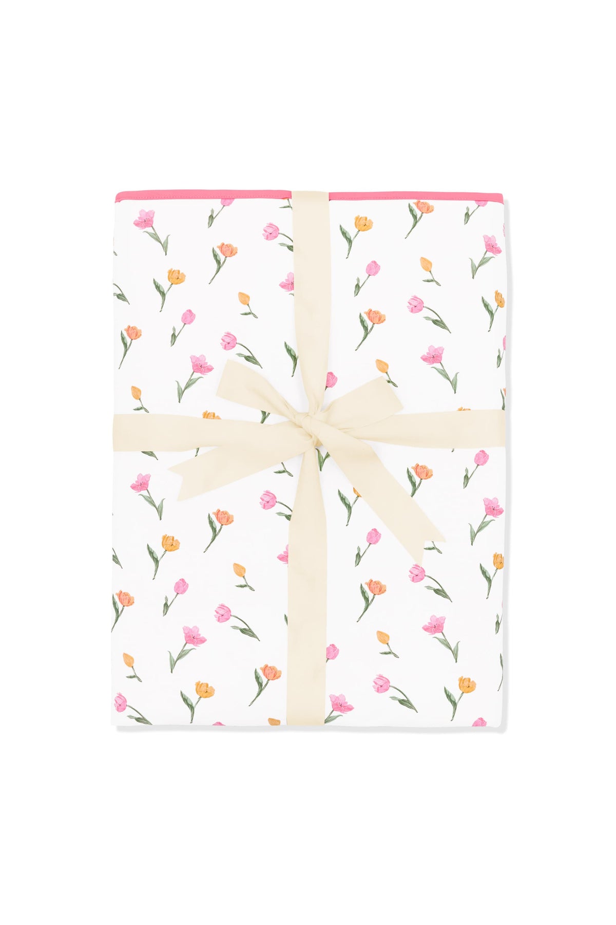 Youth Blanket in Tulip 1.0 shown in its packaging tied with a linen bow