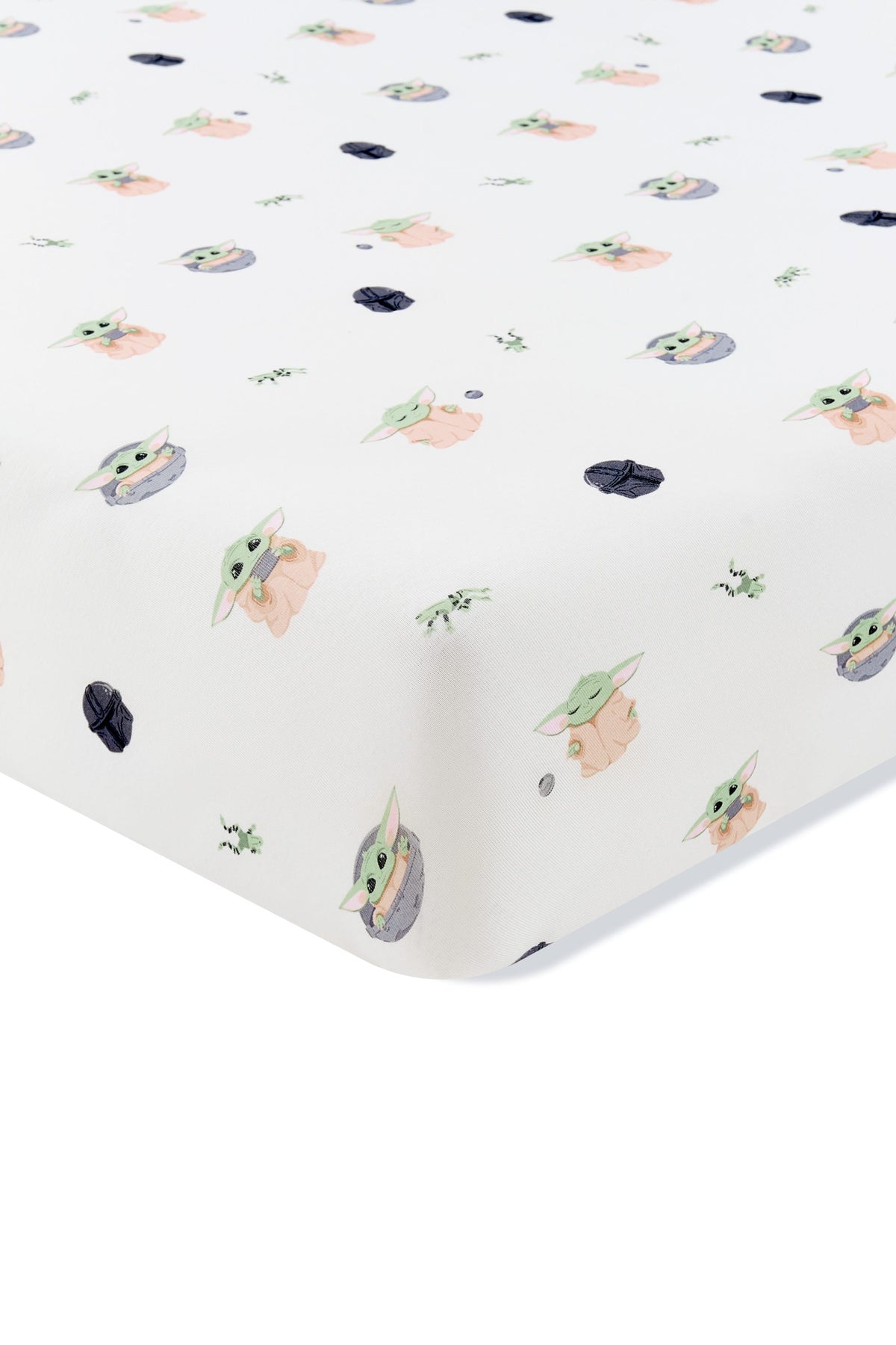 Corner of the Crib Sheet in Grogu™ shown on a crib mattress