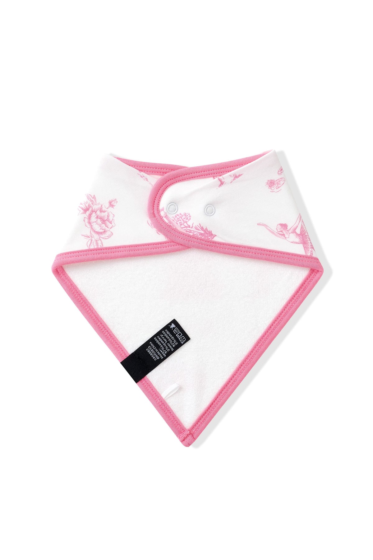 The back of the Bib in Toile Ballet showing the snap closure and bamboo terry cloth backing