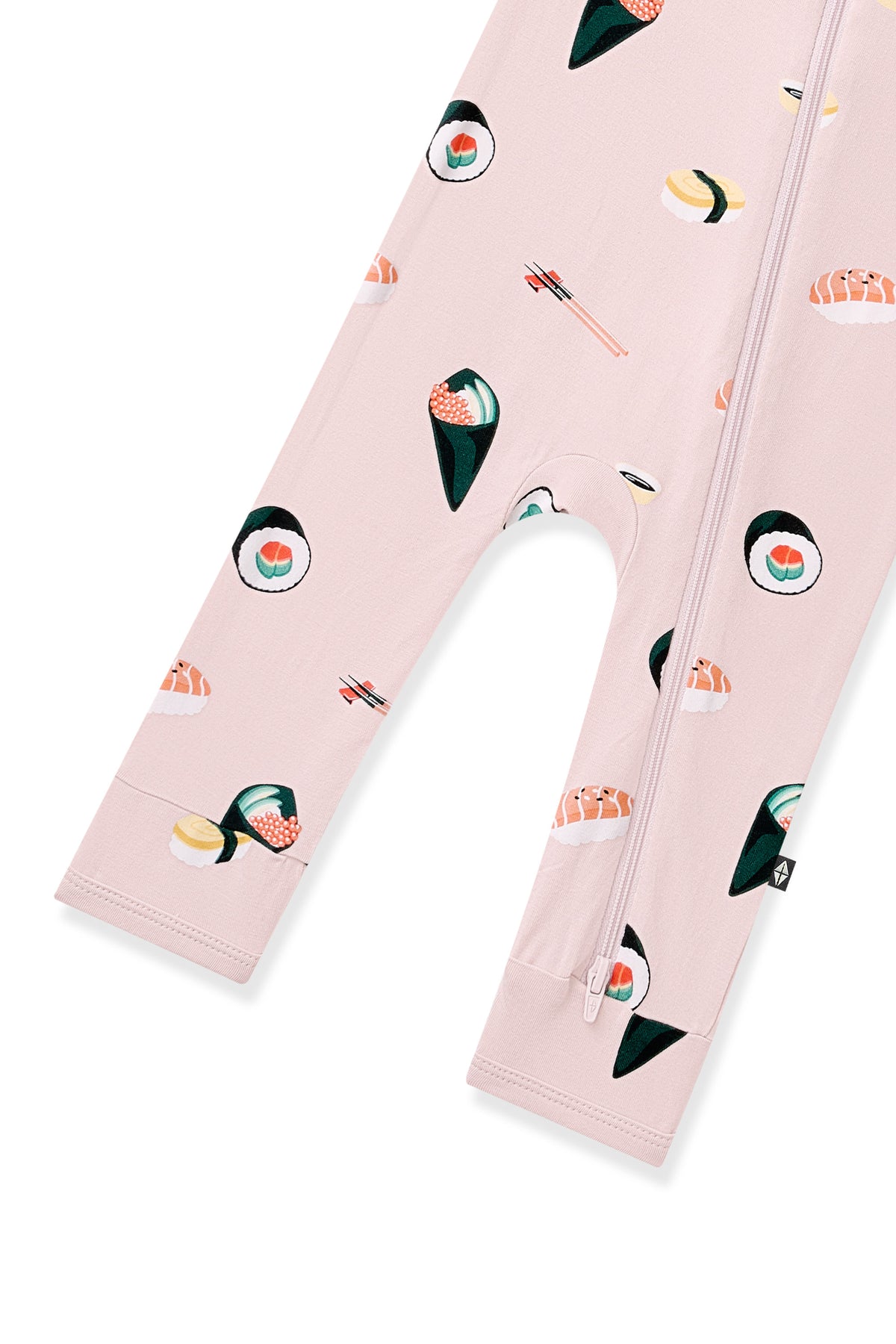 Bottom part of Pink Zippered Romper with Sushi pattern on white background