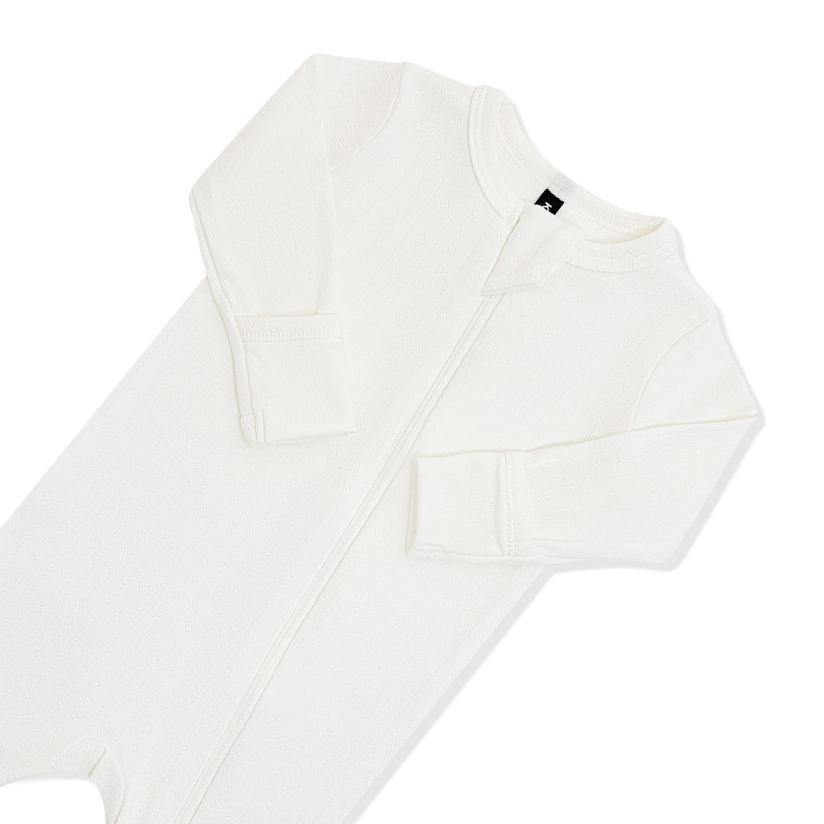 Close up of the zipper garage and fold over hand cuffs on the Pointelle Zippered Footie in Cloud