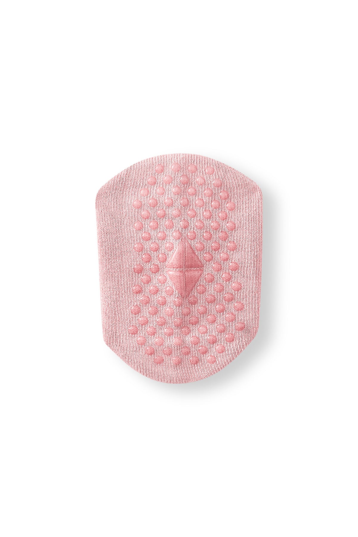 Bottom of a sock int he color blush with grips.