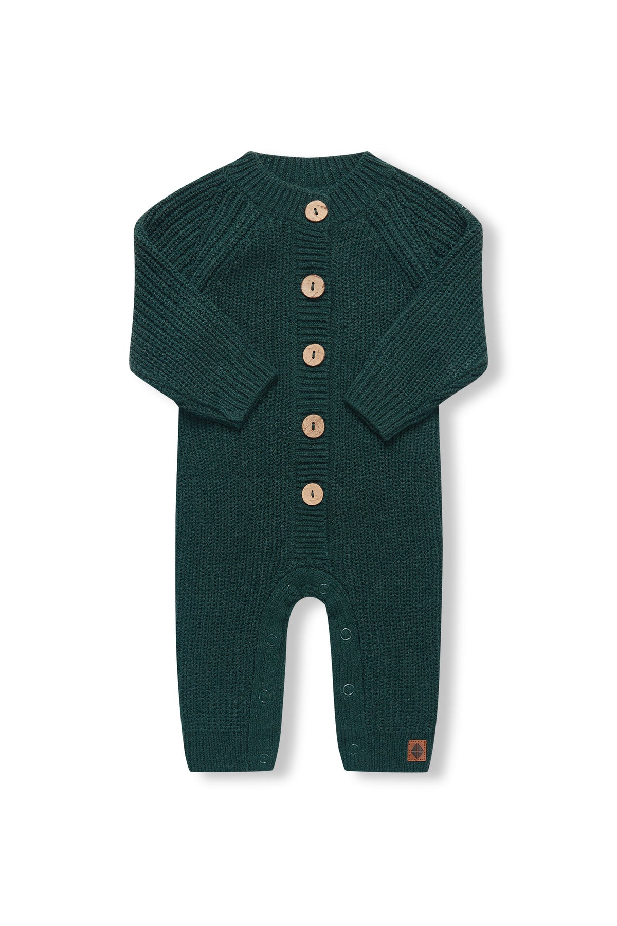 Chunky Knit Jumpsuit in cypress with folded sleeves on a white background