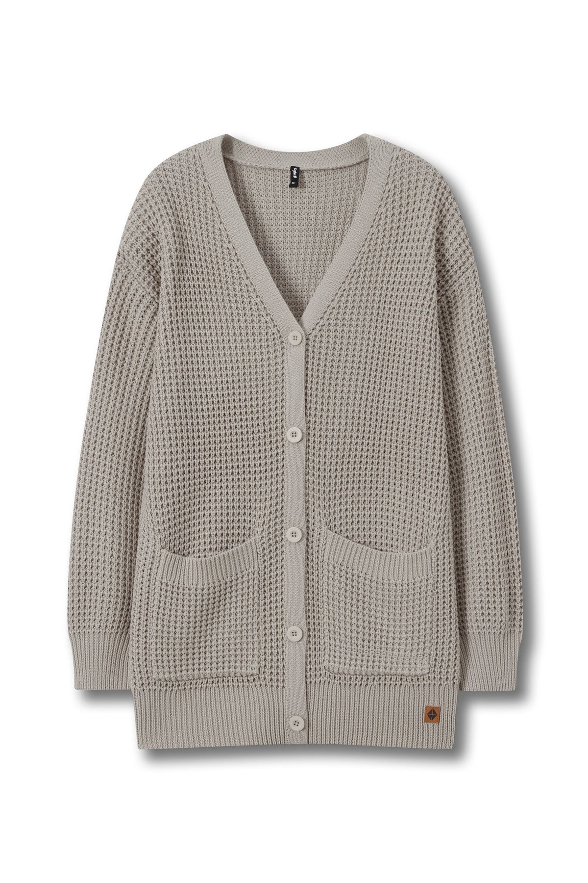 A light taupe waffle-knit cardigan sweater with a V-neck, button-up front, and two front patch pockets, shown flat on a white background.