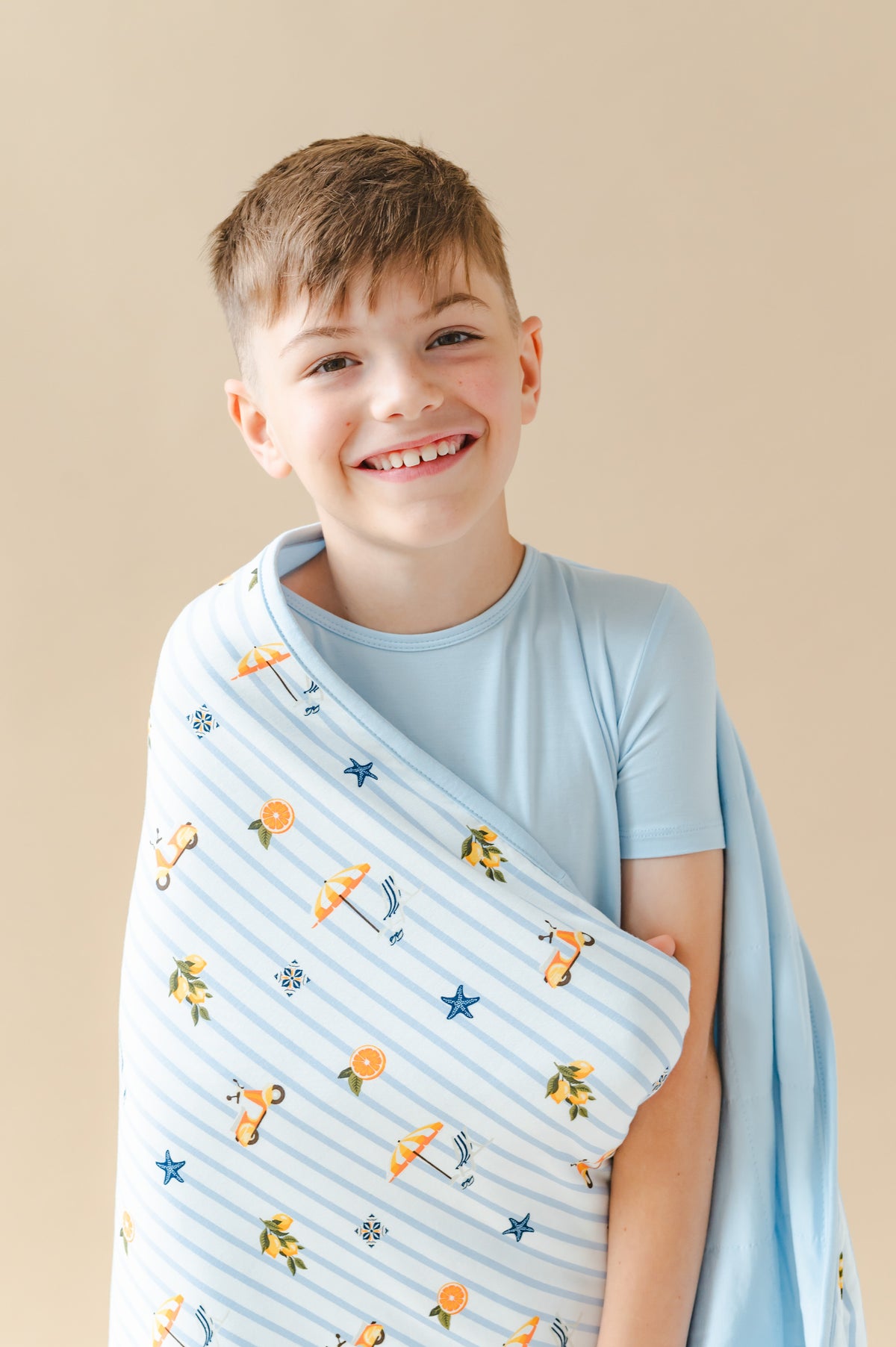 Close up of young model with the Youth Blanket in Amalfi Coast 1.0 around him