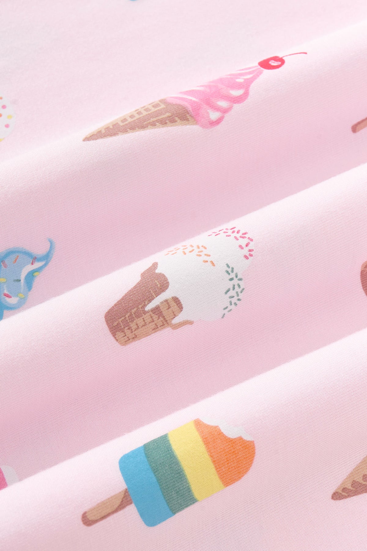 Close up of colorful Ice Cream print on pink color fabric