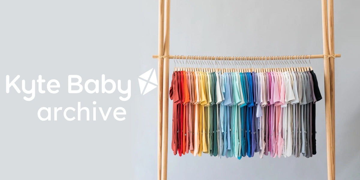 kyte baby archive image showing clothing rack of footies in a rainbow of colors