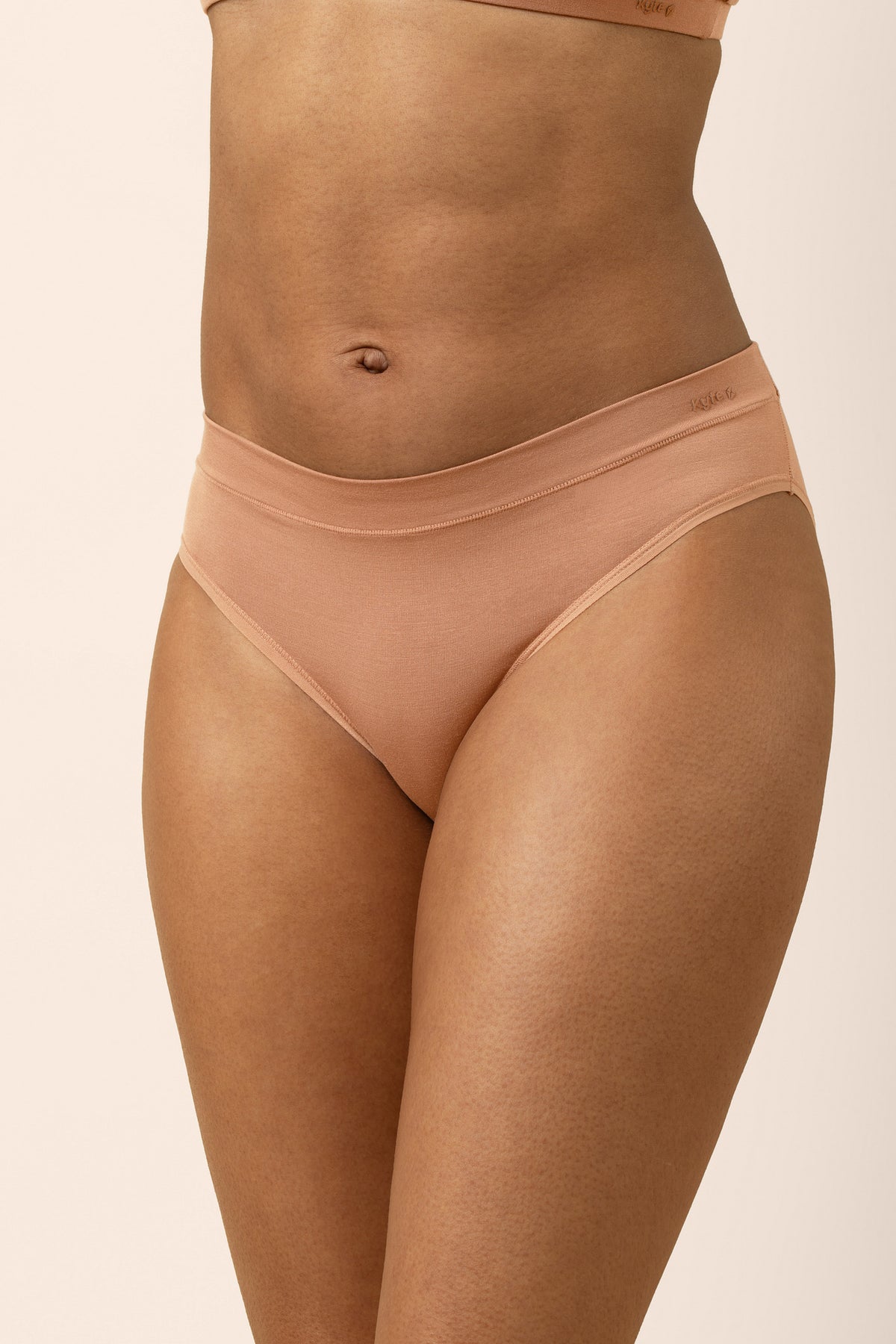 The front of the Women's Midi Brief in Latte shown on a model