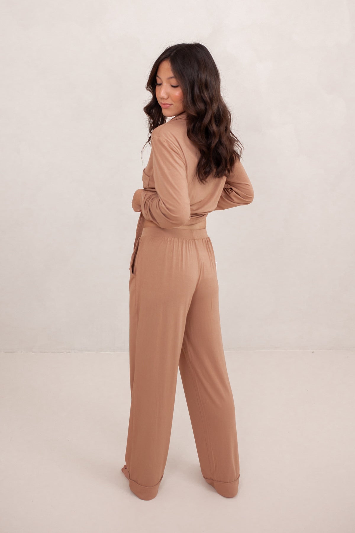 The back of the Long-Sleeved Women's Pajama Set in Latte with Latte Trim shown on a female model
