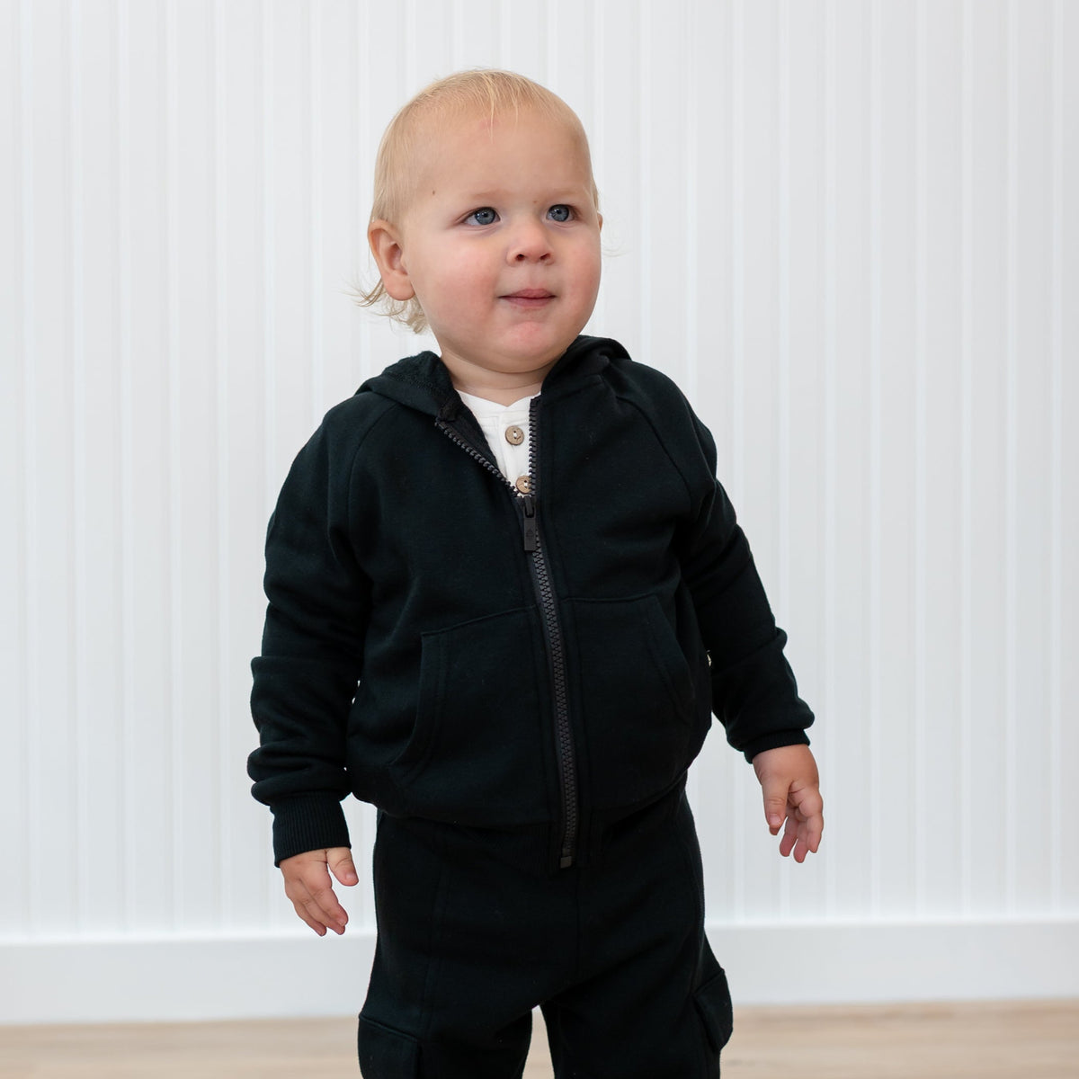 Close up of the Fleece Zip Up Hoodie in Midnight shown on a toddler