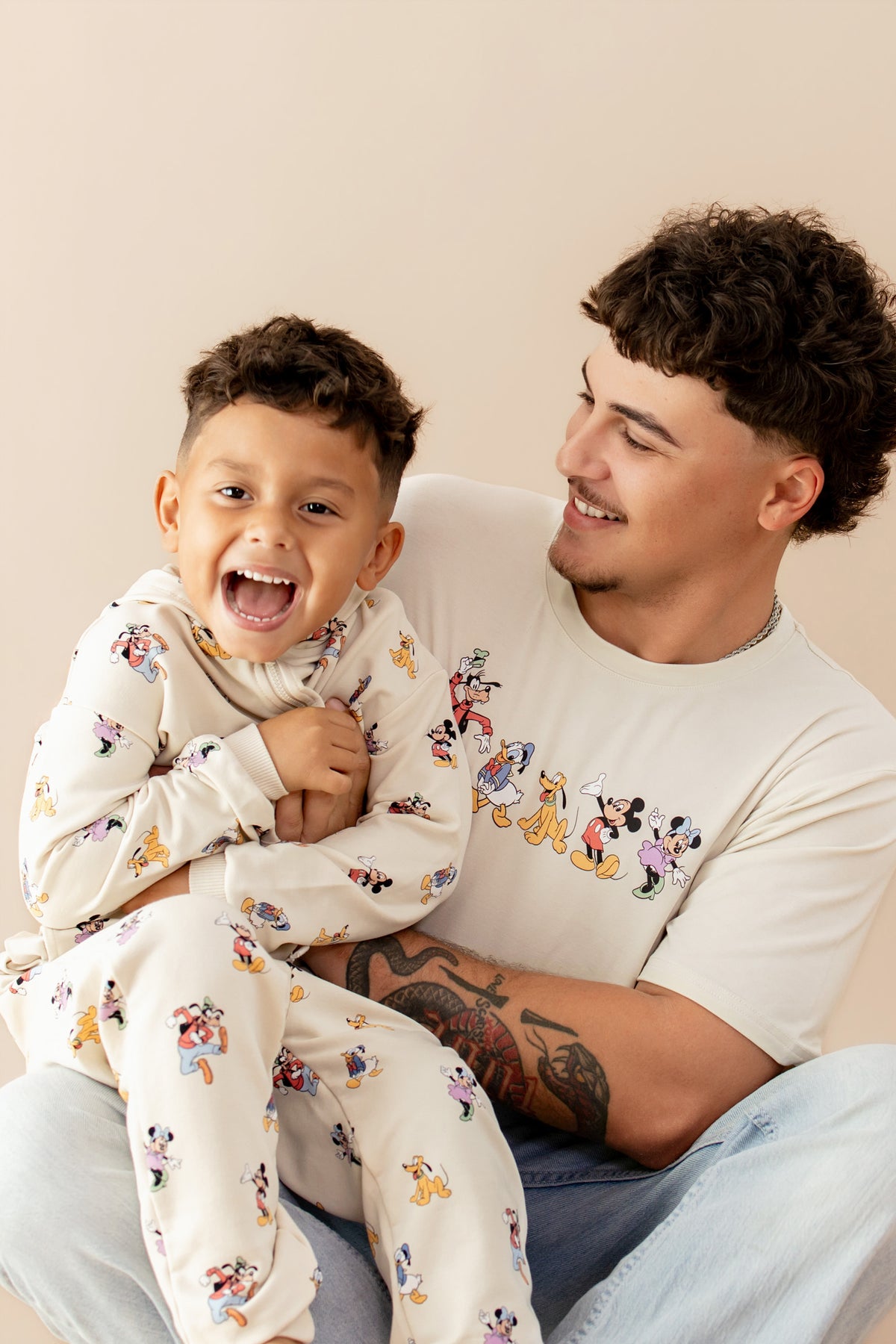 Dad and child wearing mickey mouse kyte baby daywear collection
