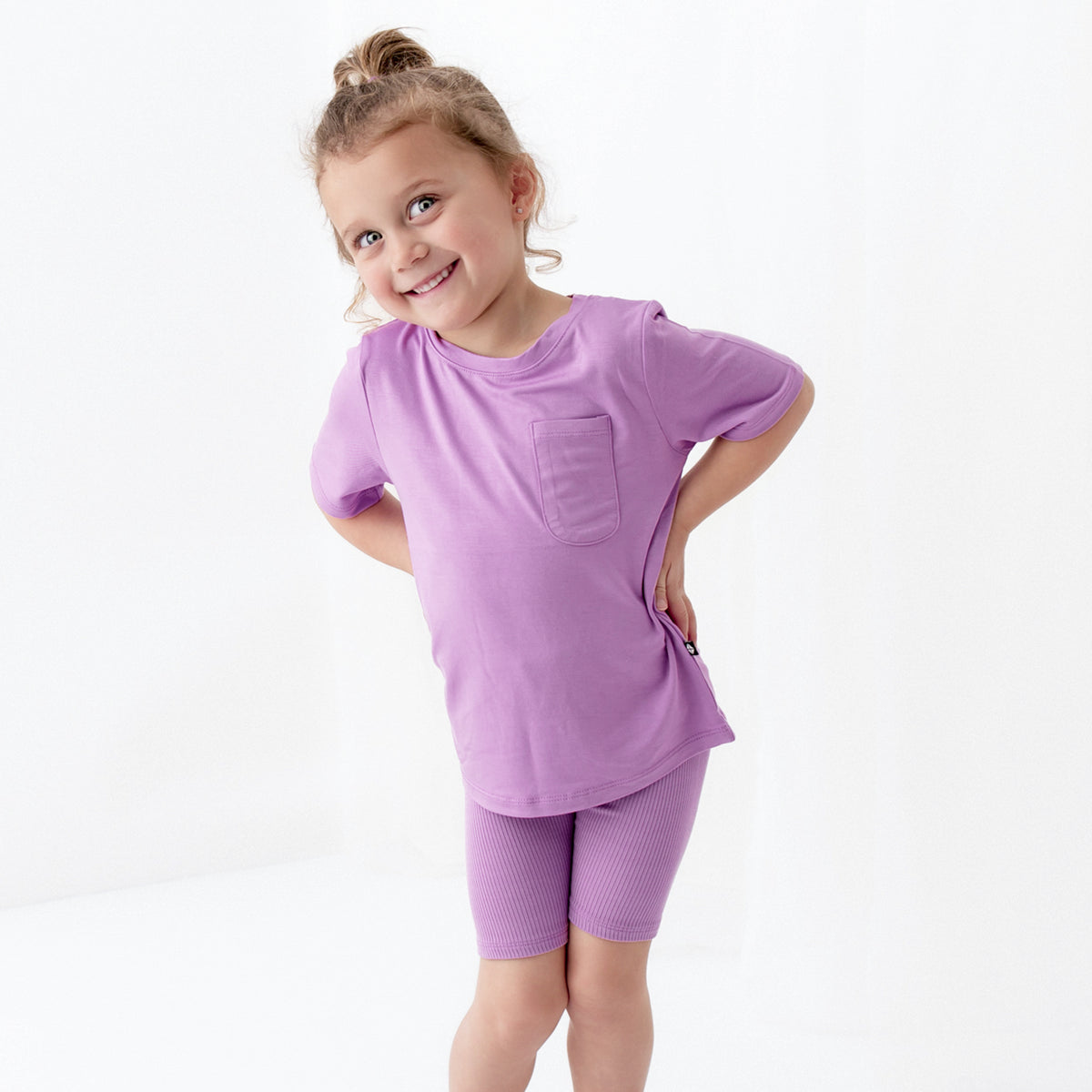 Child wearing Ribbed Toddler Biker Shorts in Poi Purple