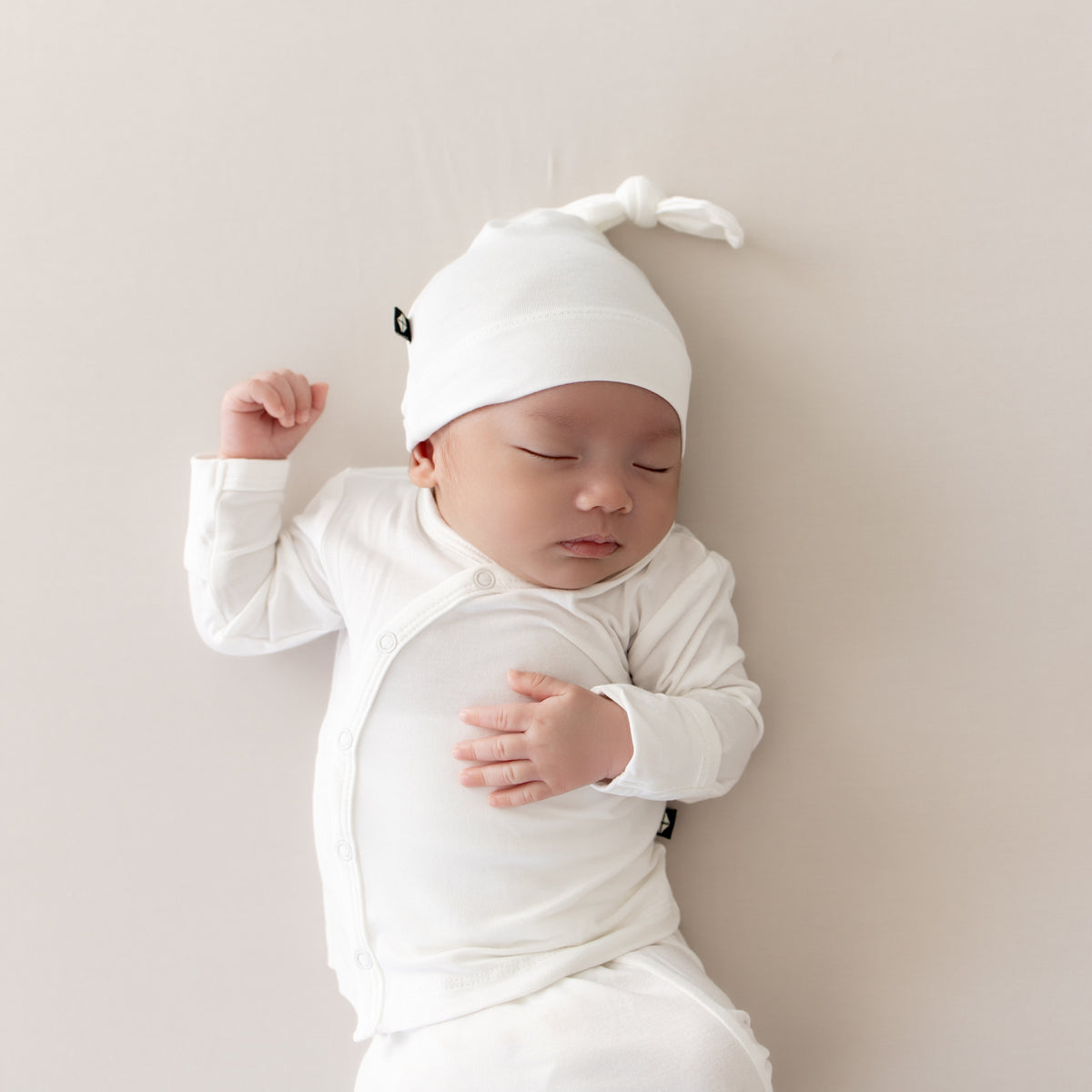 Sleeping Newborn in Take Me Home Set with Cap in Cloud