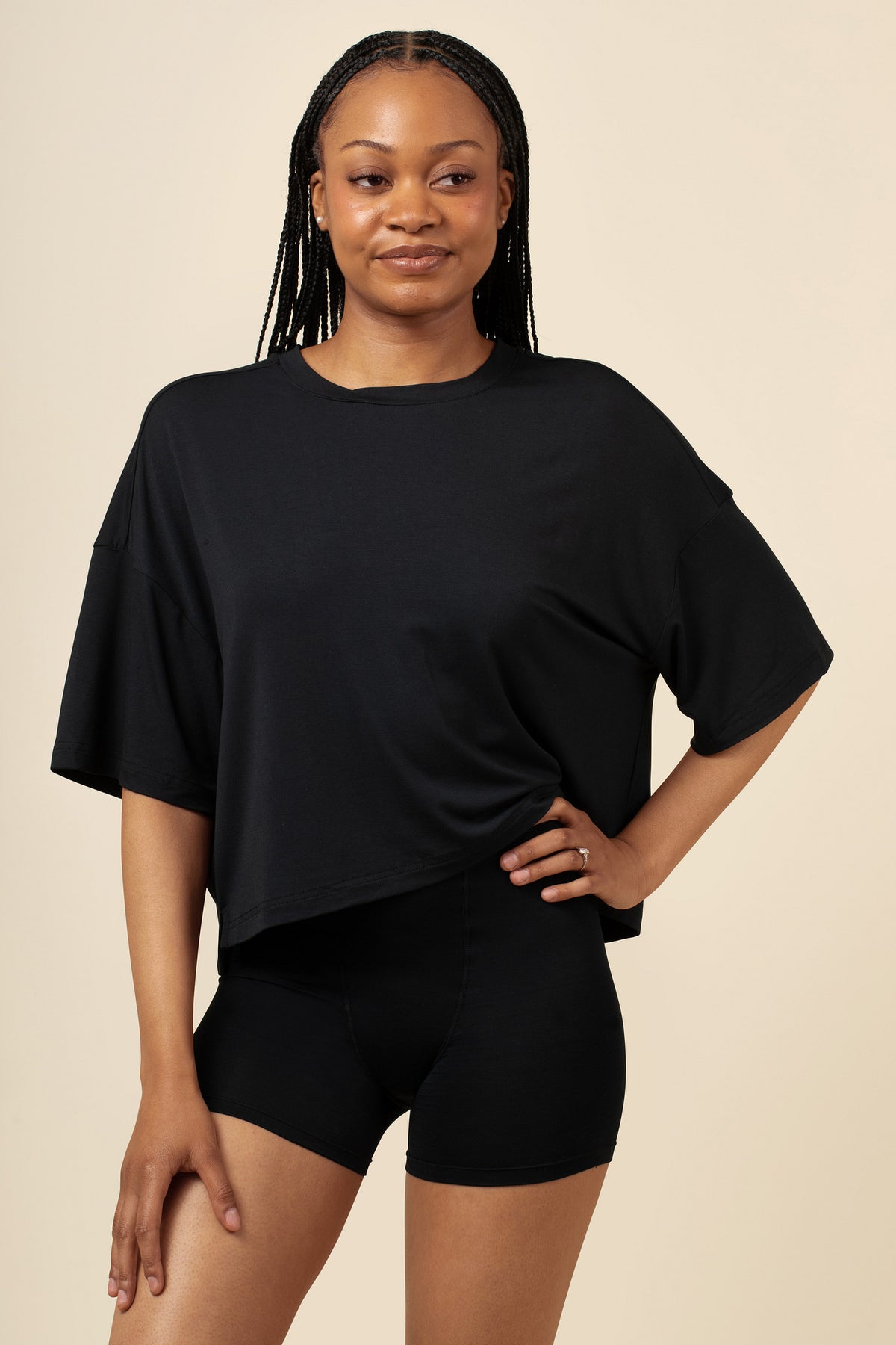 Woman wearing a black tee and boxer short