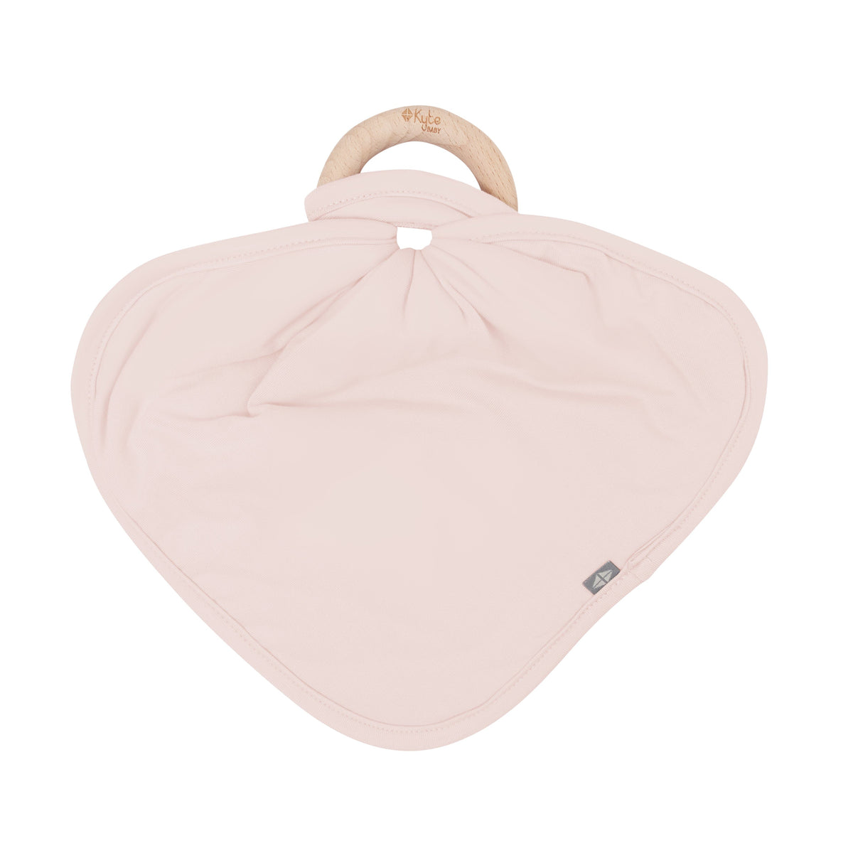 Flat lay of Kyte Baby Lovey in Blush with Removable Wooden Teething Ring