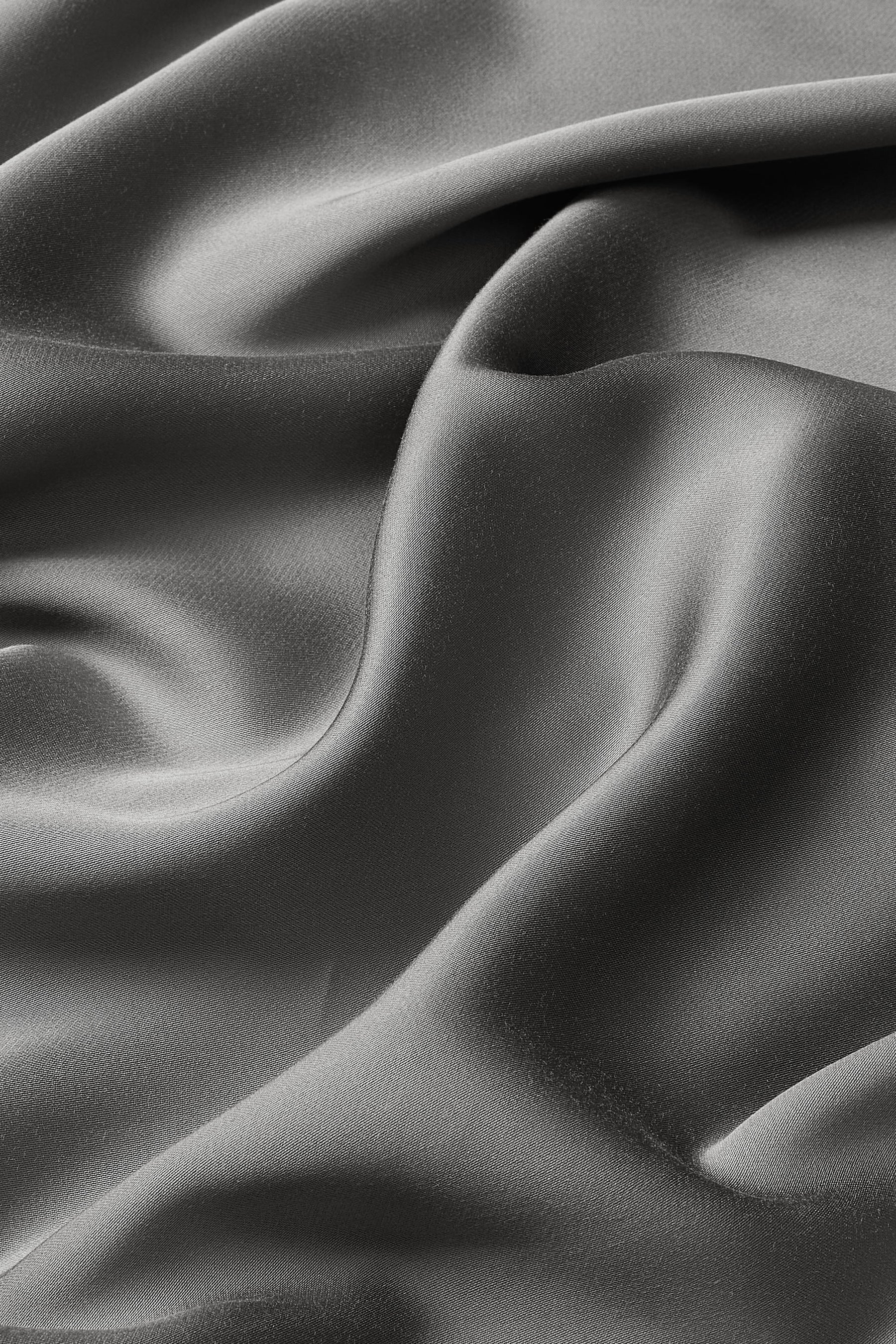 Close up of the bamboo sateen fabric: A warm charcoal grey