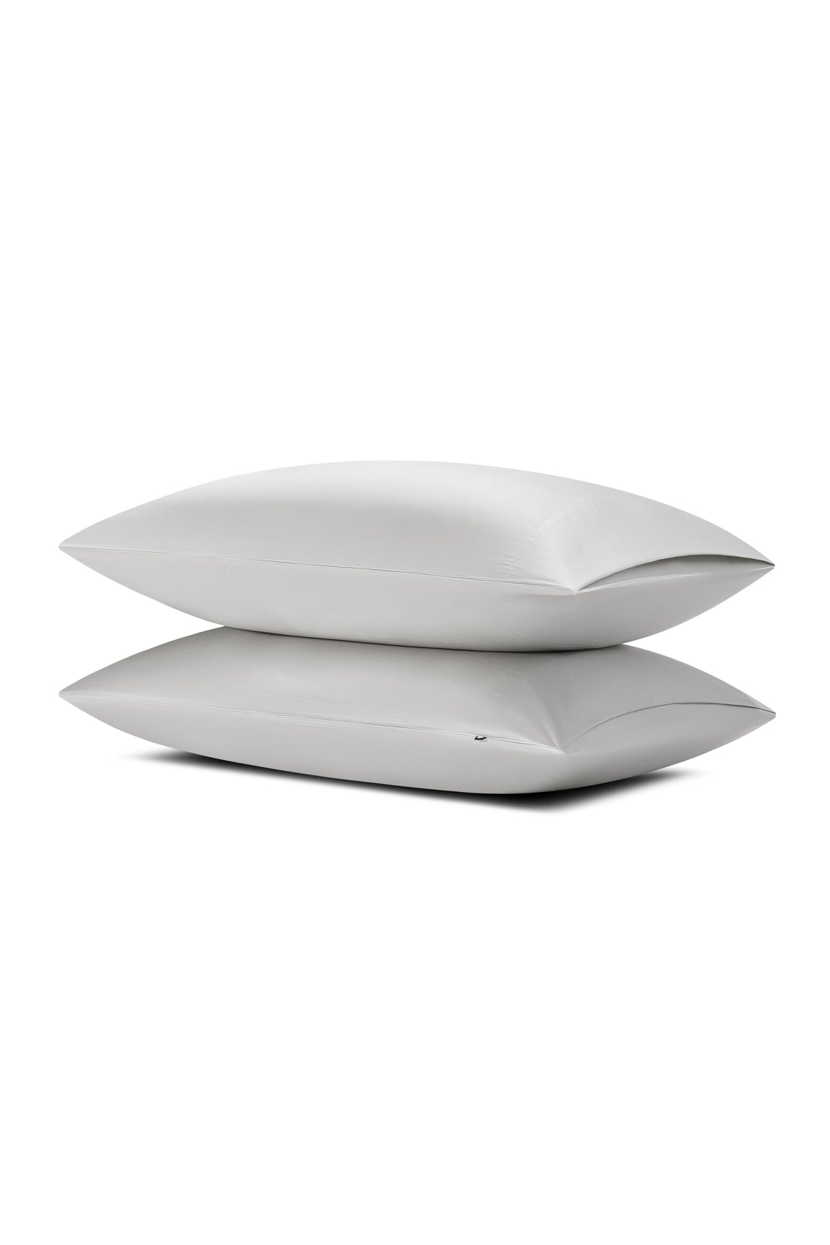 Two pillows stacked one on top of the other with the Bamboo Sateen Pillowcase in Dove Gray on them