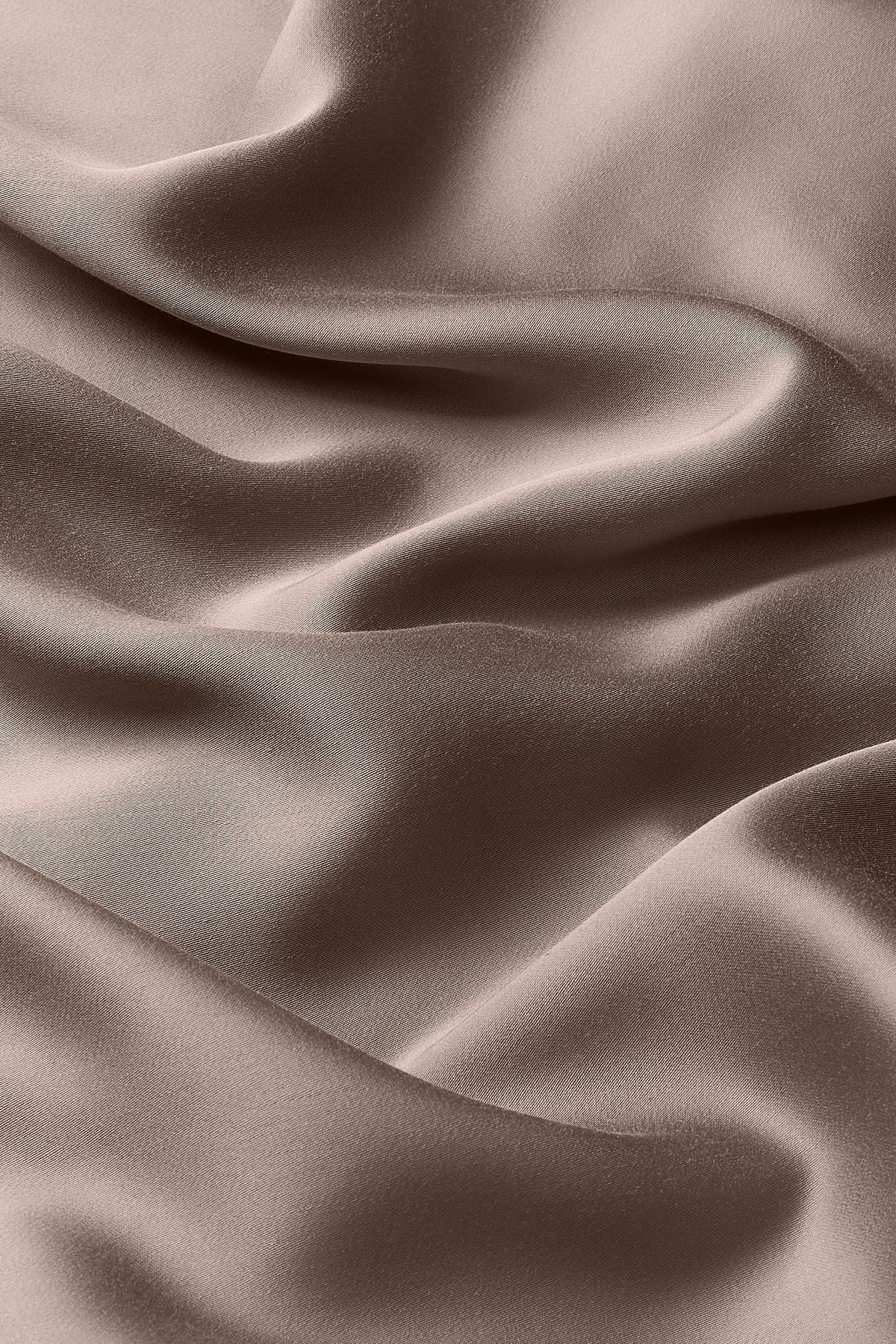 Close up of the bamboo sateen material: A medium grey-brown