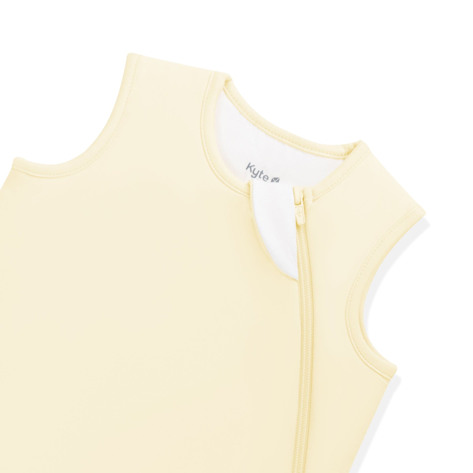 Close up of the zipper garage and top zipper on the Sleep Bag in Chamomile 1.0