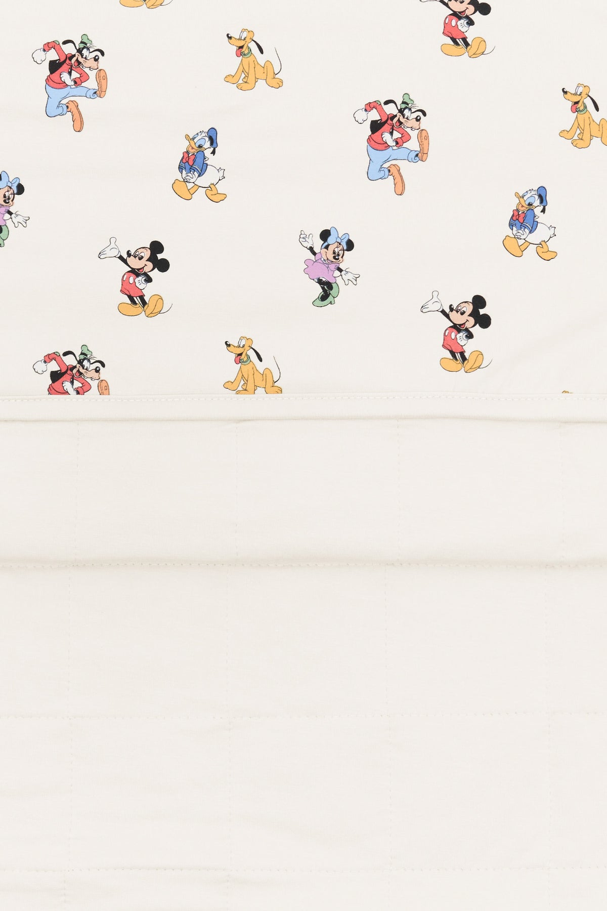 Back side fabric of baby blanket with mickey mouse and friends print on an oat background.
