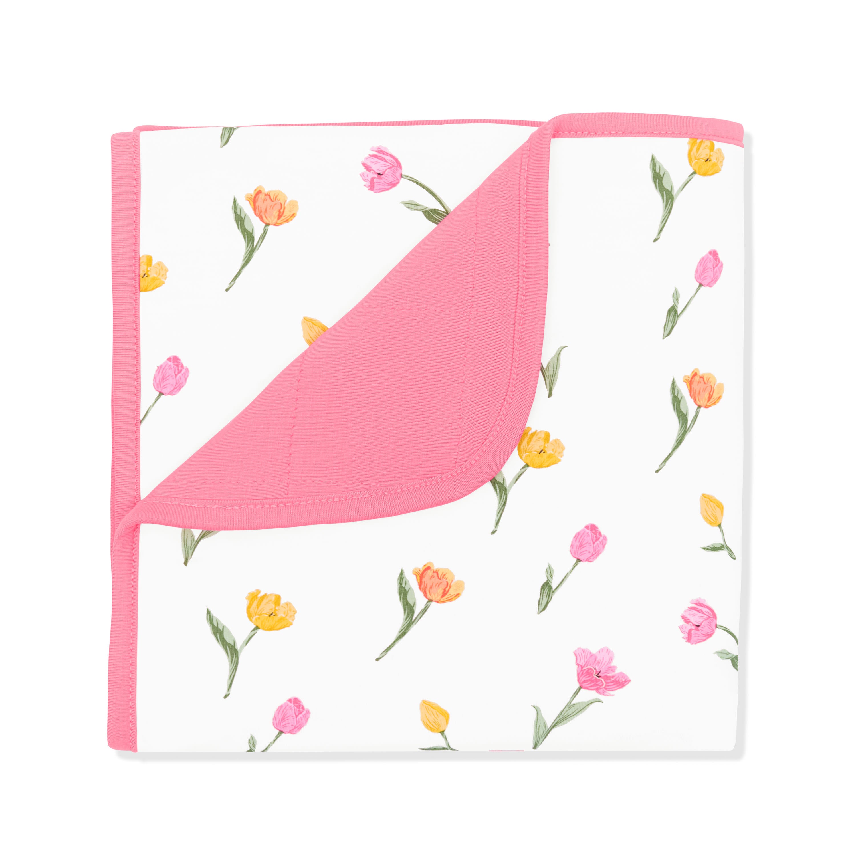 Baby Blanket in Tulip with the corner flipped down showing the dark pink Guava backing