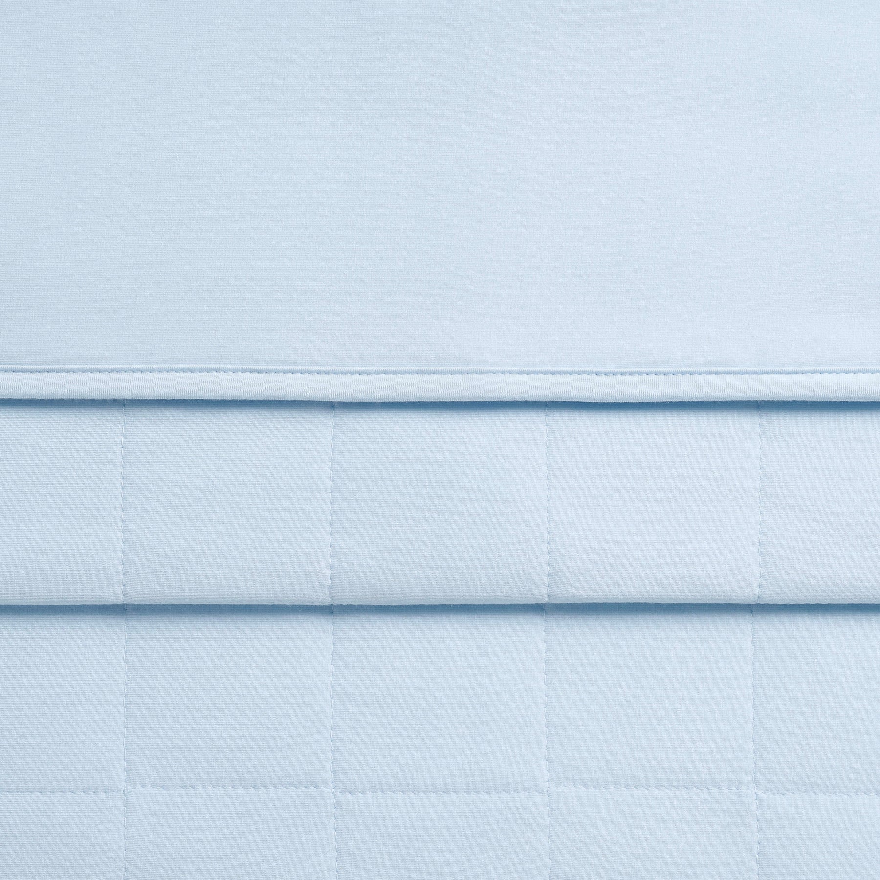 Close up of the quilted backing and smooth top of the Baby Blanket in Breeze 1.0