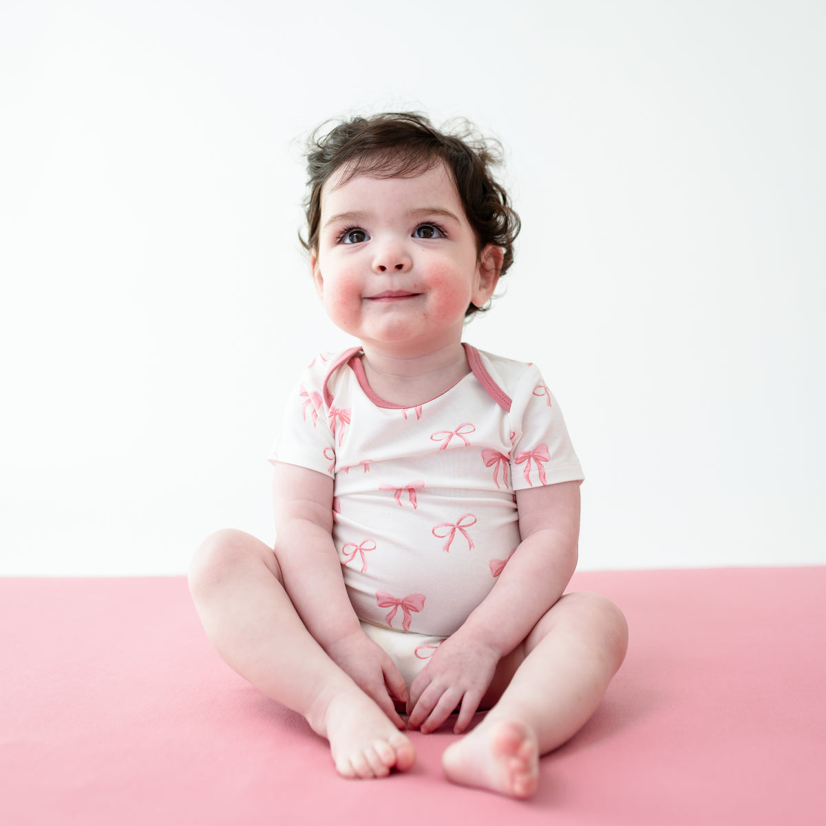 Young toddler wearing Bodysuit in Bow