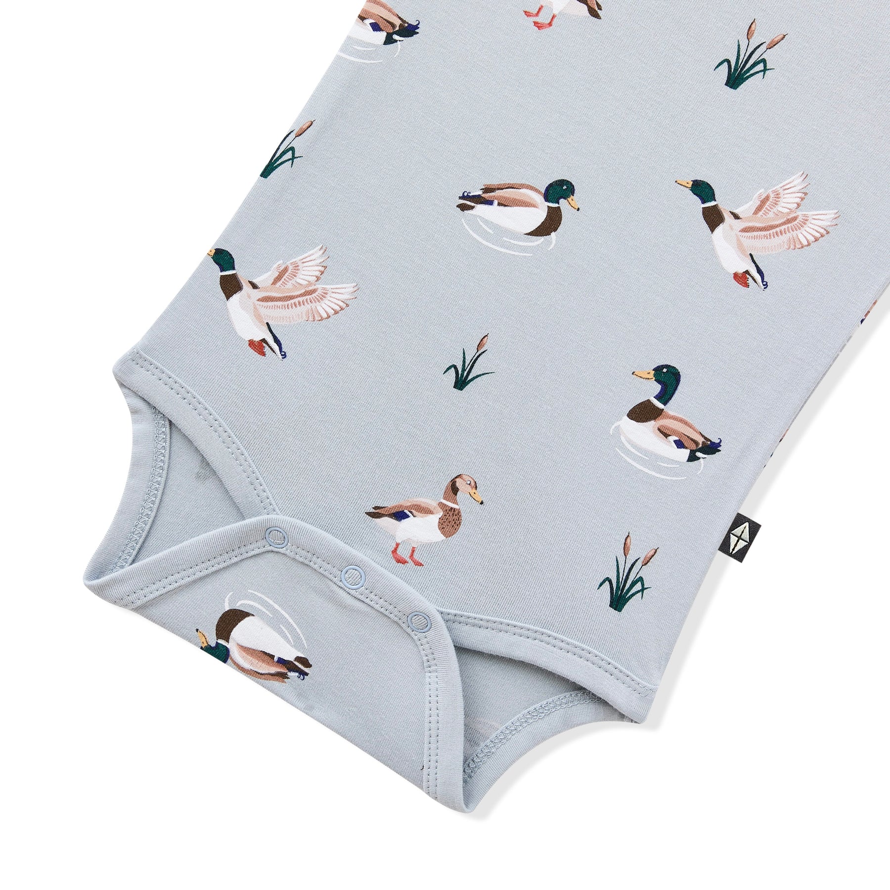 Close up of the snap closures shown on the Bodysuit in Mallard Duck