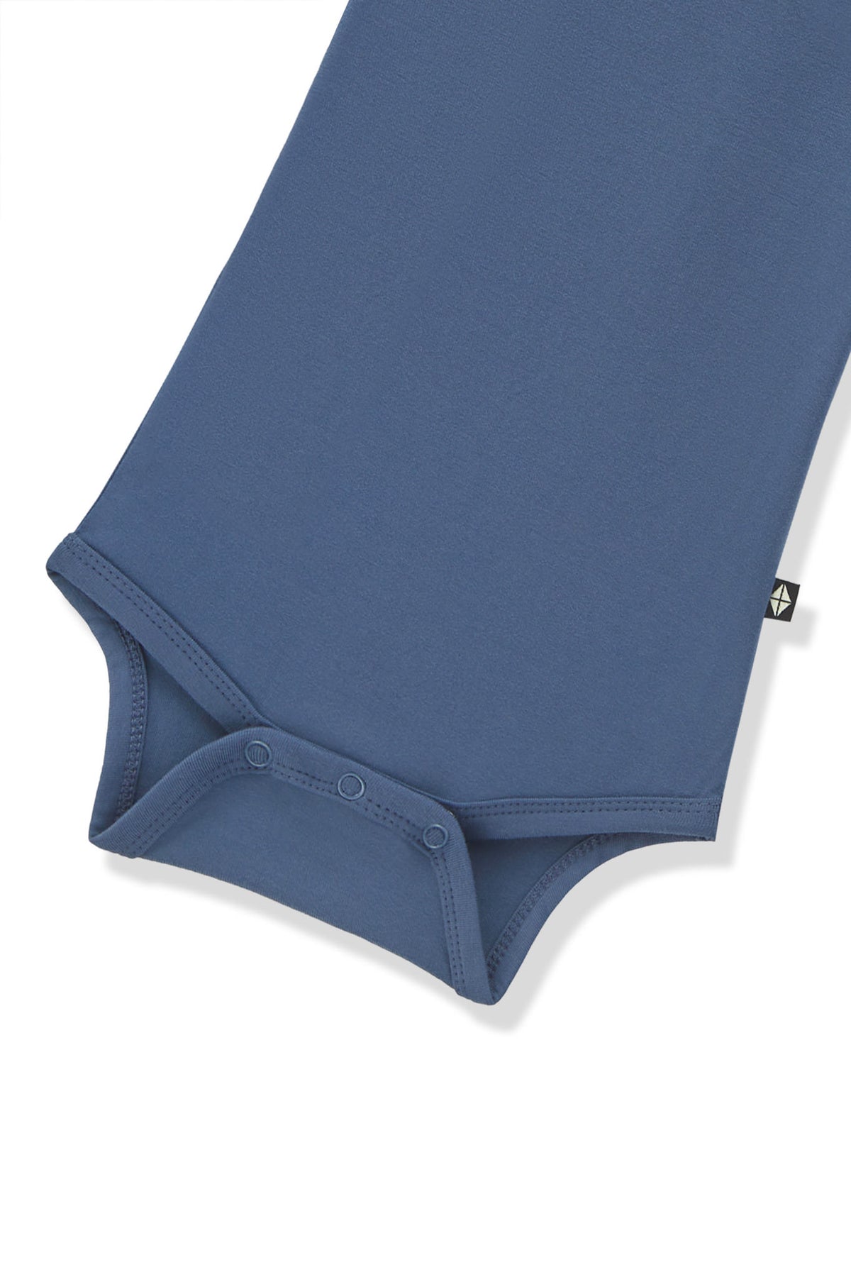 Bottom part of Long Sleeve Bodysuit in Oxford with snap buttons on a white background