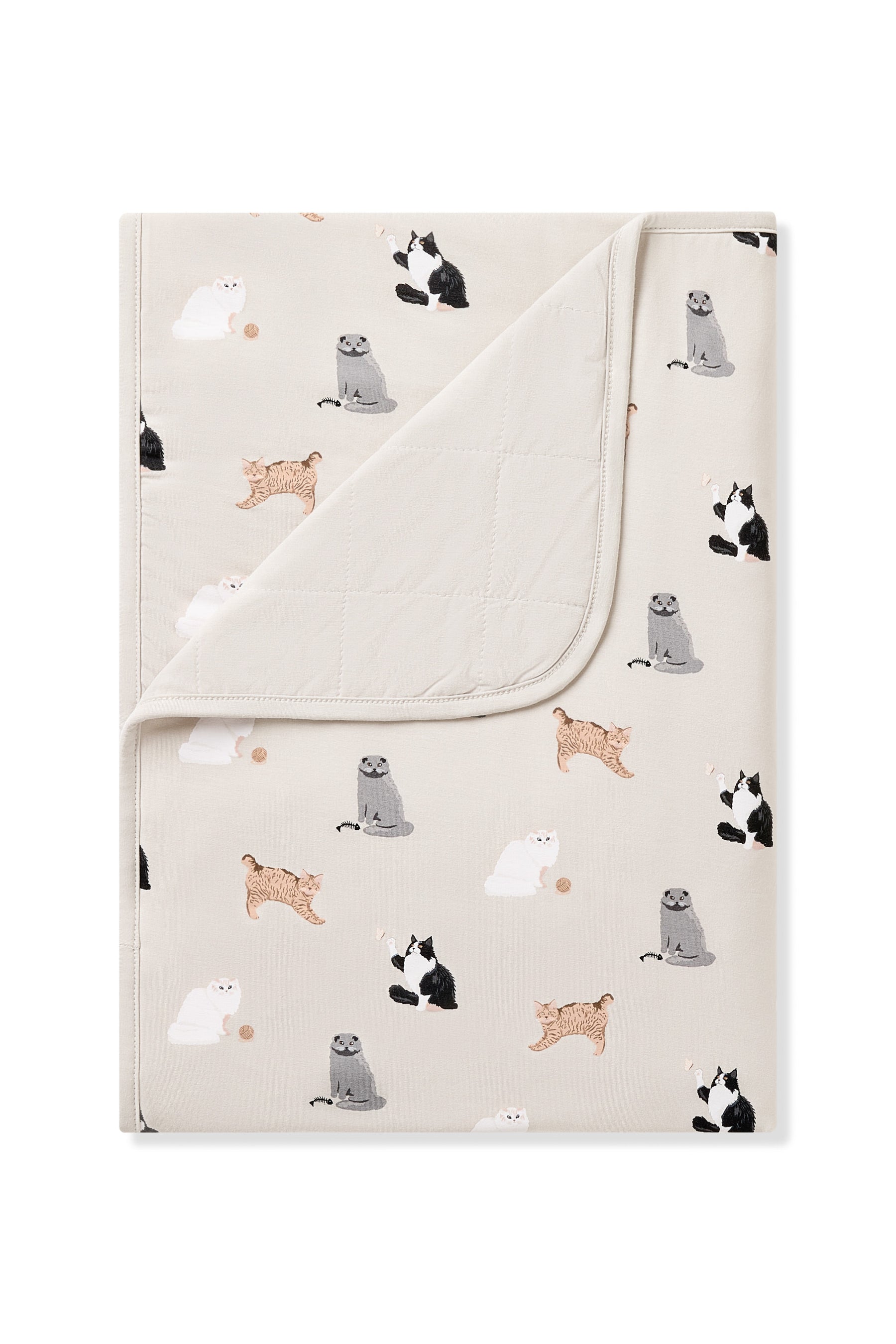 Toddler Blanket in Fluffy Cat 1.0 with the corner flipped down showing the light beige quilted backing