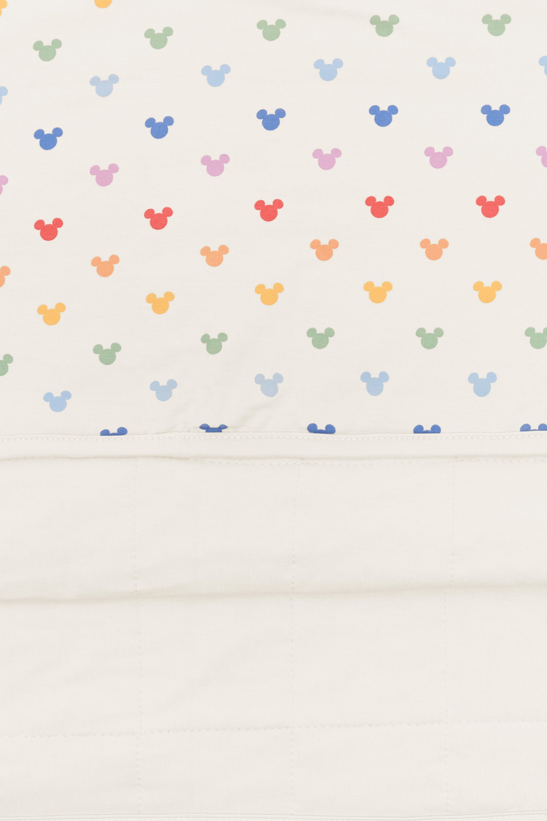 Back side fabric of Toddler Blanket in Pastel Mickey Mouse pattern on an oat background