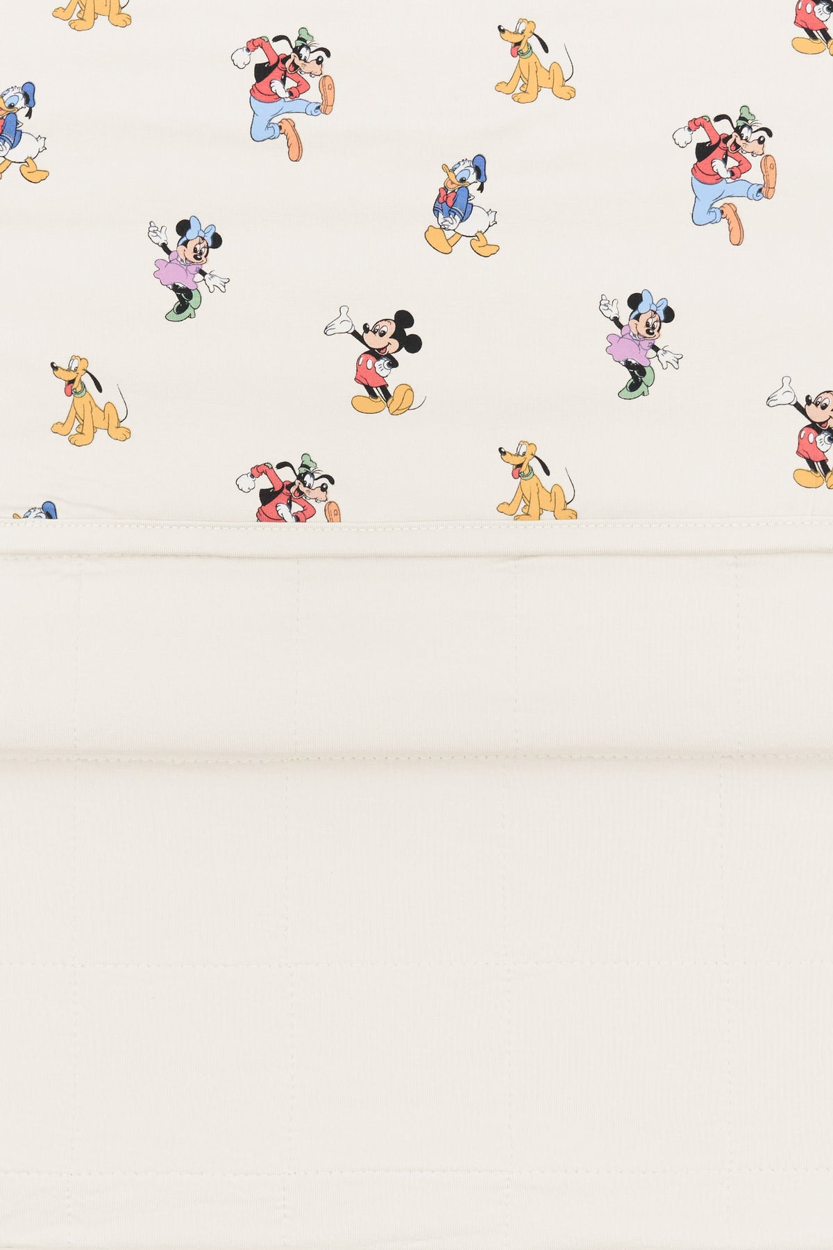 Back side fabric of Toddler Blanket in Mickey Mouse and Friends print on an oat background