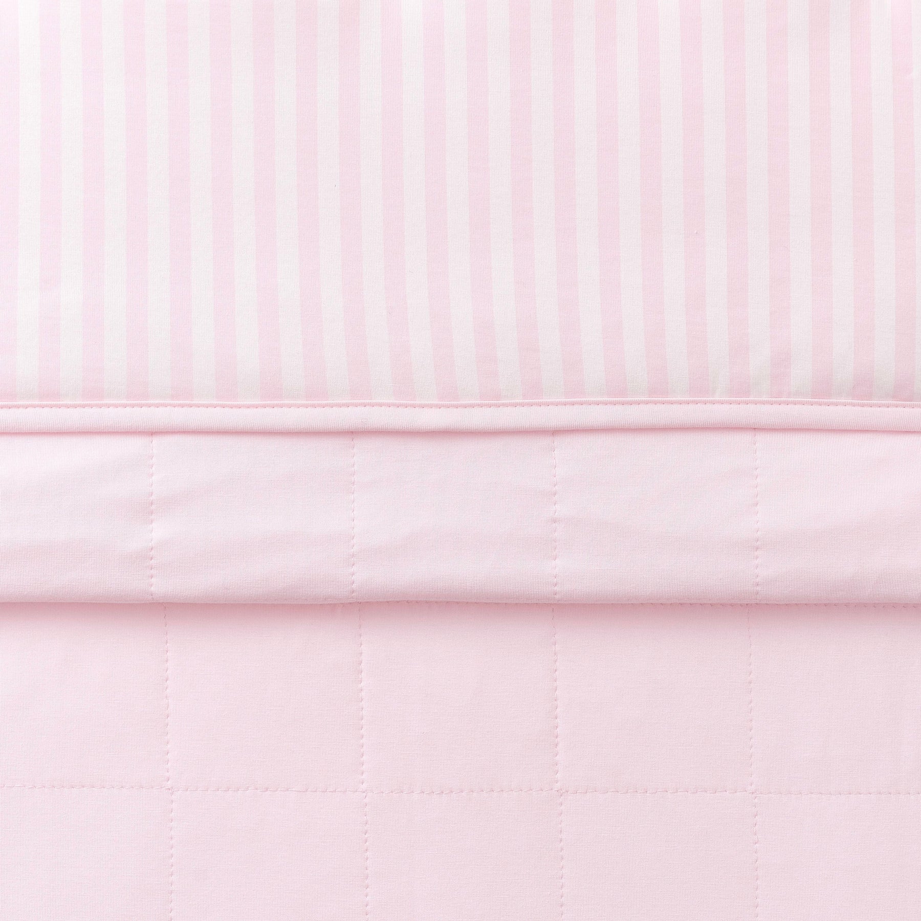 Toddler Blanket in Small Sakura Stripe 1.0 folded showing the quilted detail on the back of the blanket and the print detail on the front