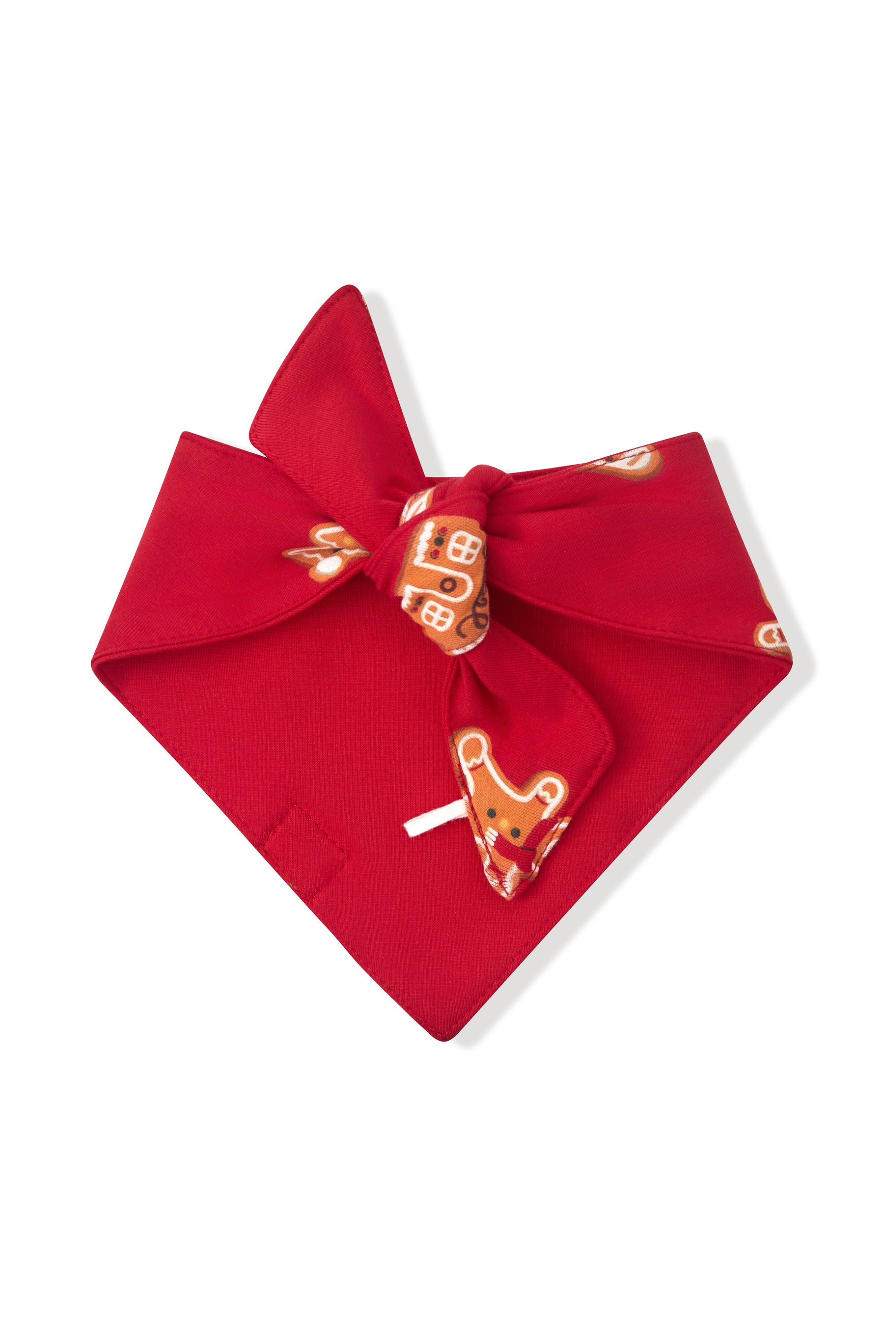 A red bandana tie-on bow featuring a printed pattern of gingerbread