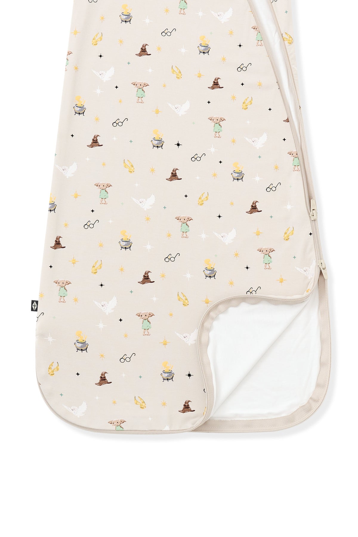 Bottom part of cream sleep bag with Harry Potter prints on a white background.