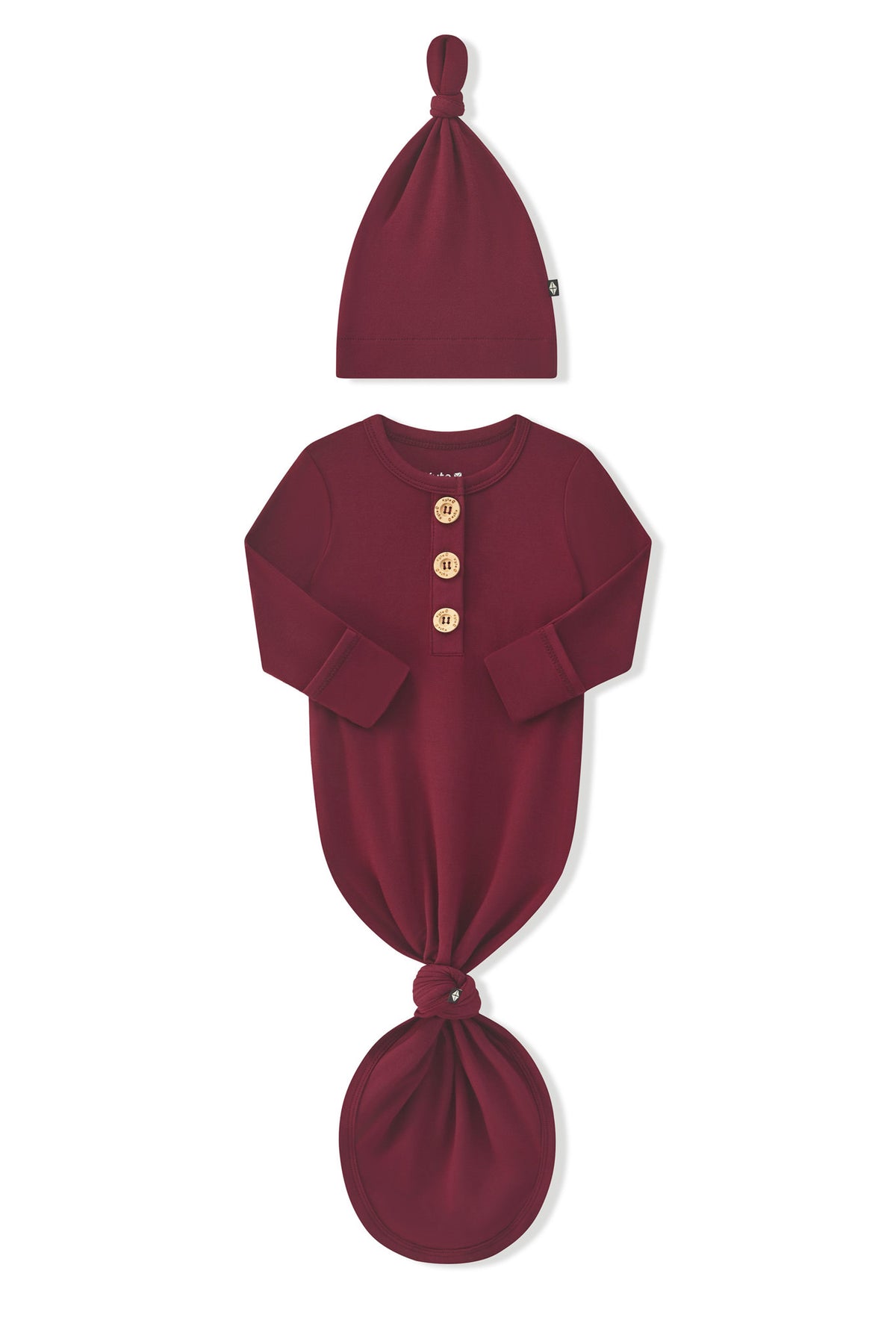 Arms of the Knotted Day Gown with Hat Set in Burgundy folded inward showing the fold over hand cuffs on a white background