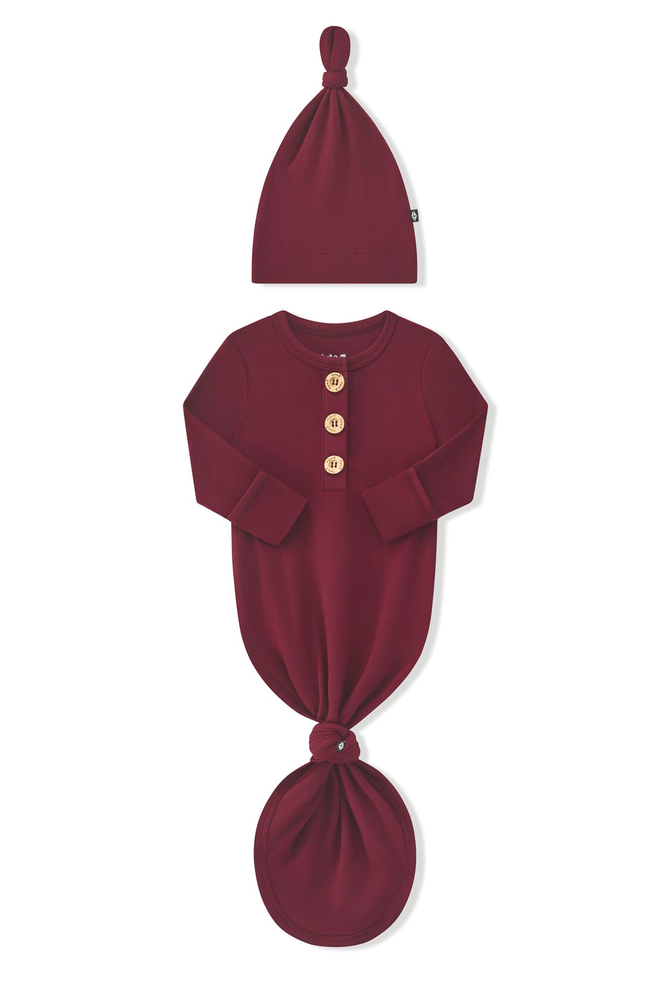 Arms of the Knotted Day Gown with Hat Set in Burgundy folded inward showing the fold over hand cuffs on a white background
