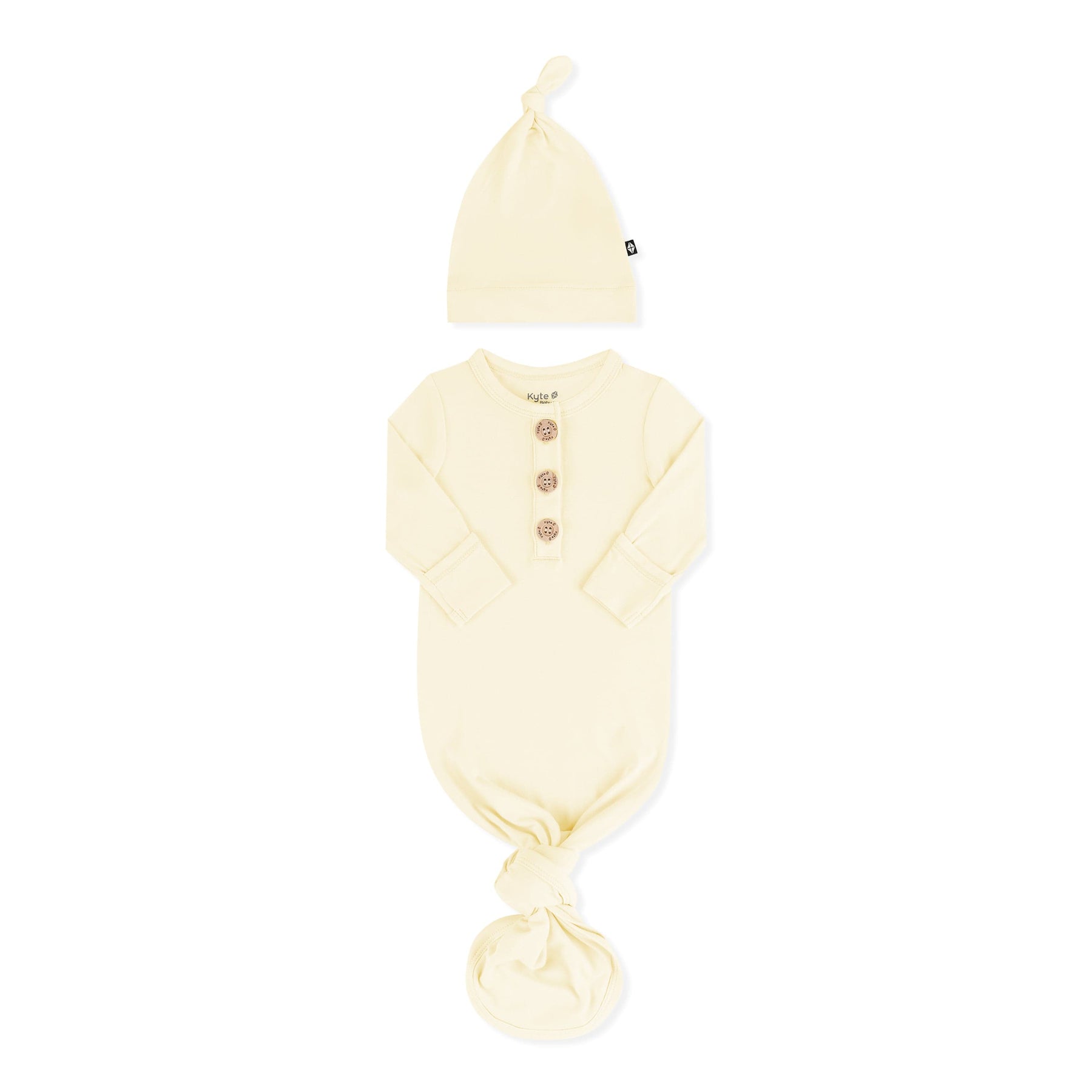Knotted Gown with Hat Set in Chamomile with the arms folded inward