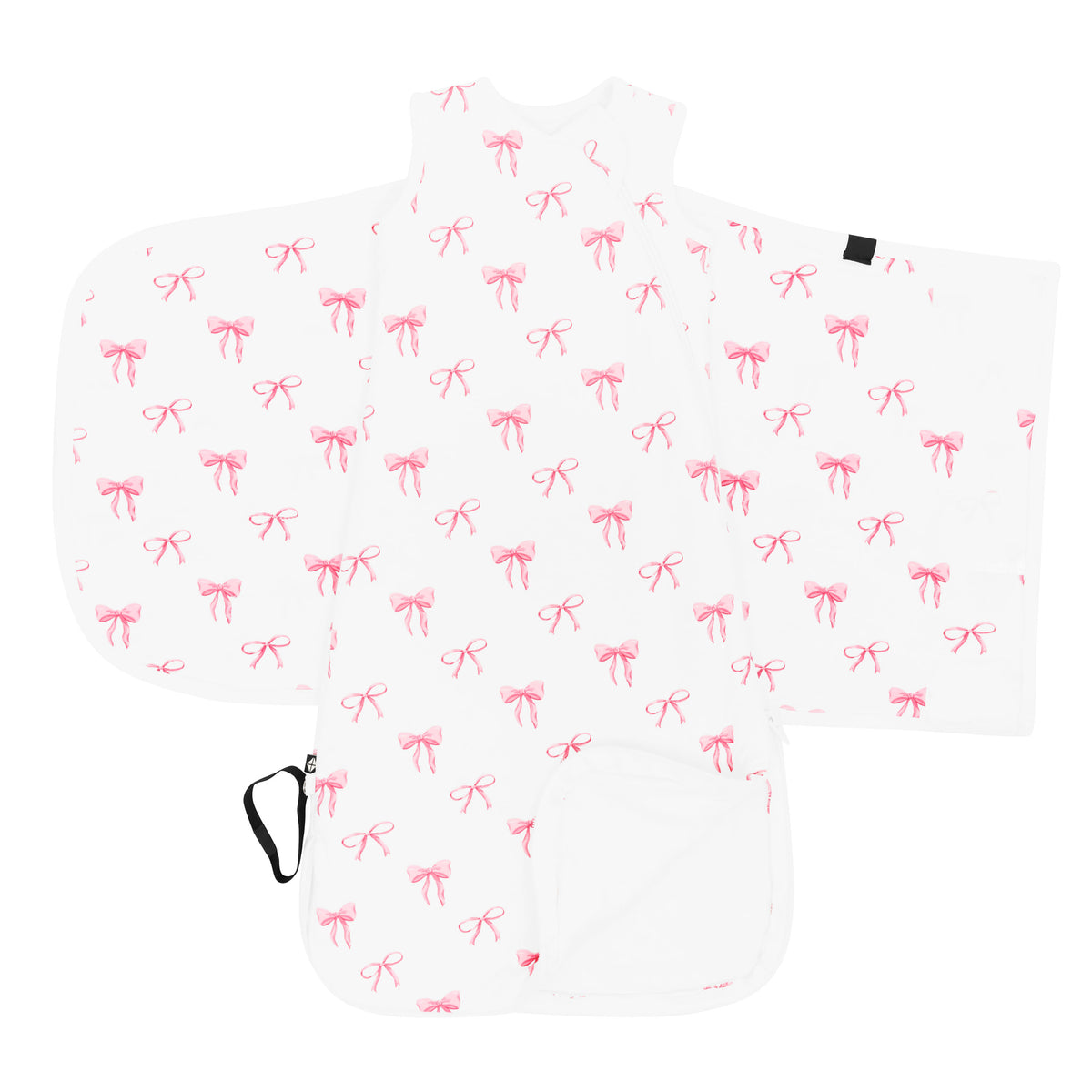 Kyte Baby's Sleep Bag Swaddler in Bow 1.0 shown unswaddled with the bottom zipper undone