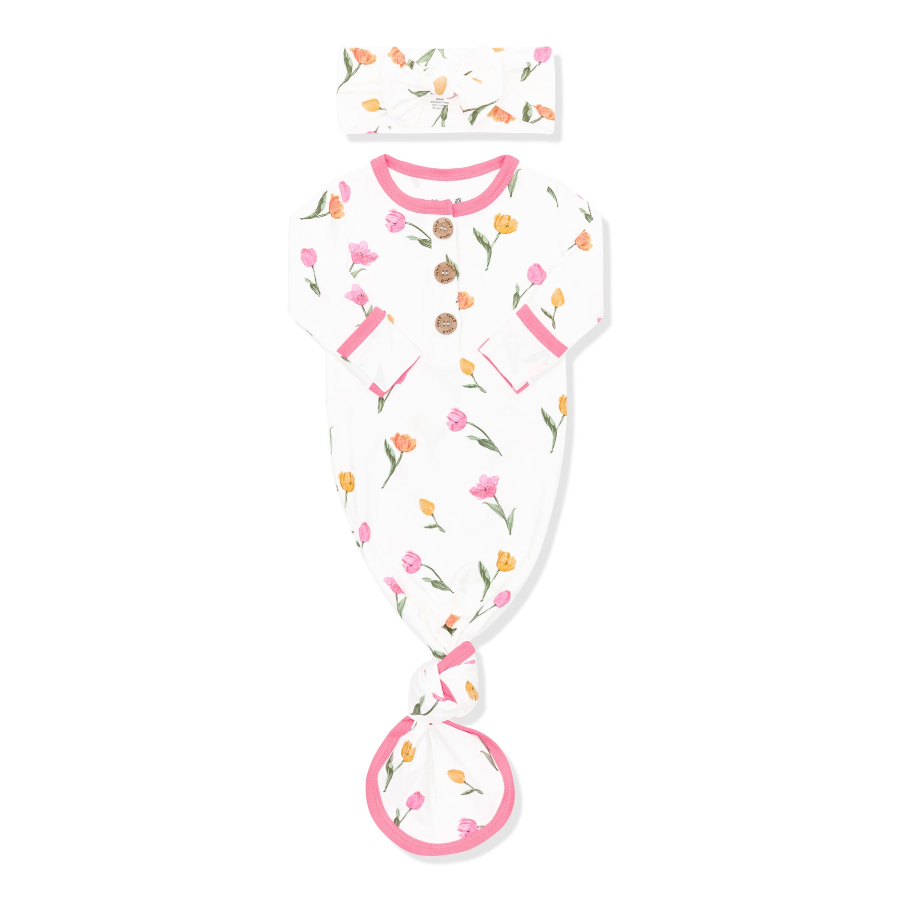 Knotted Gown with Bow Set in Tulip shown with the arms folded inwards  on a white surface