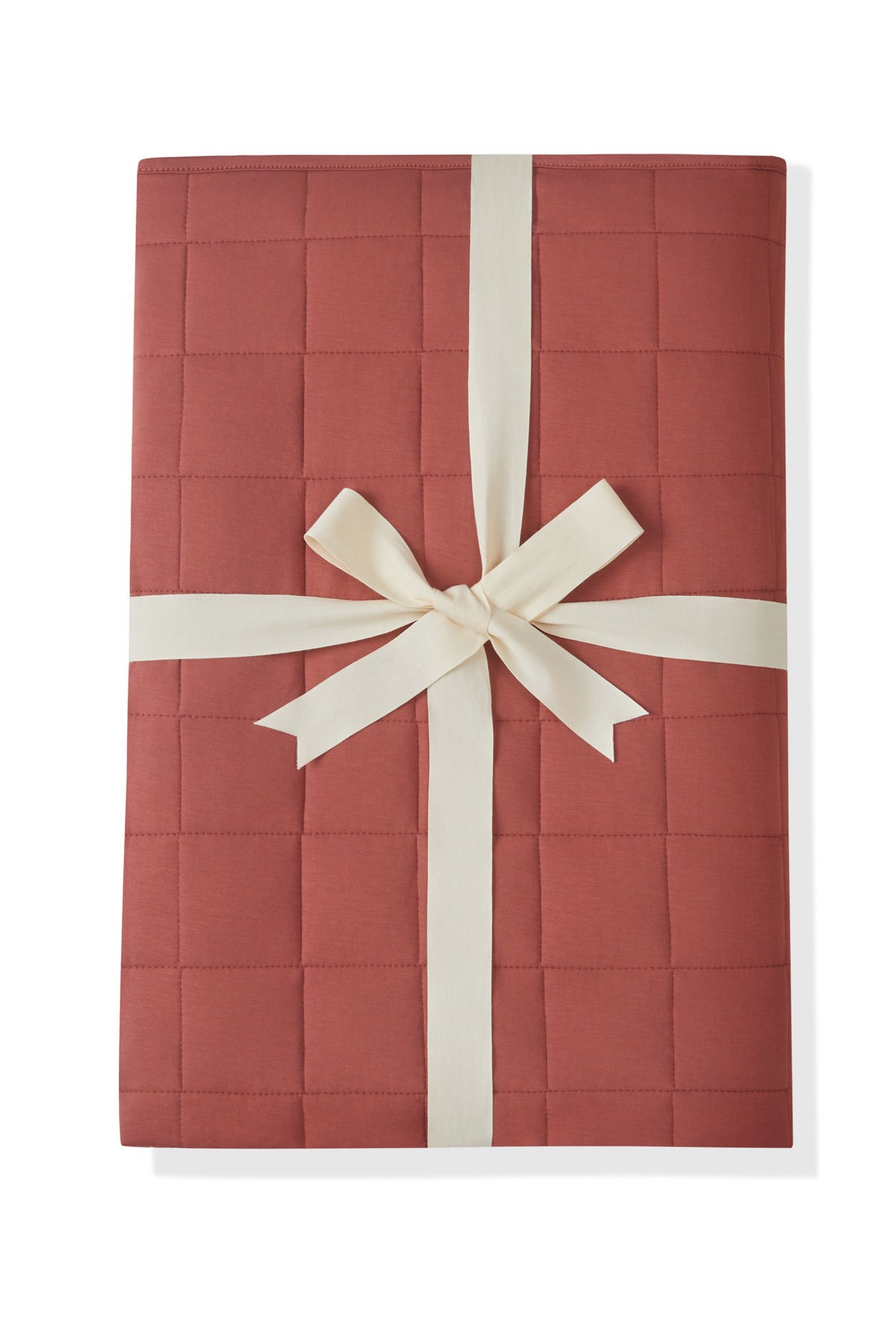 Adult Quilted Blanket in Ember 2.5 packed with a ribbon on a white background