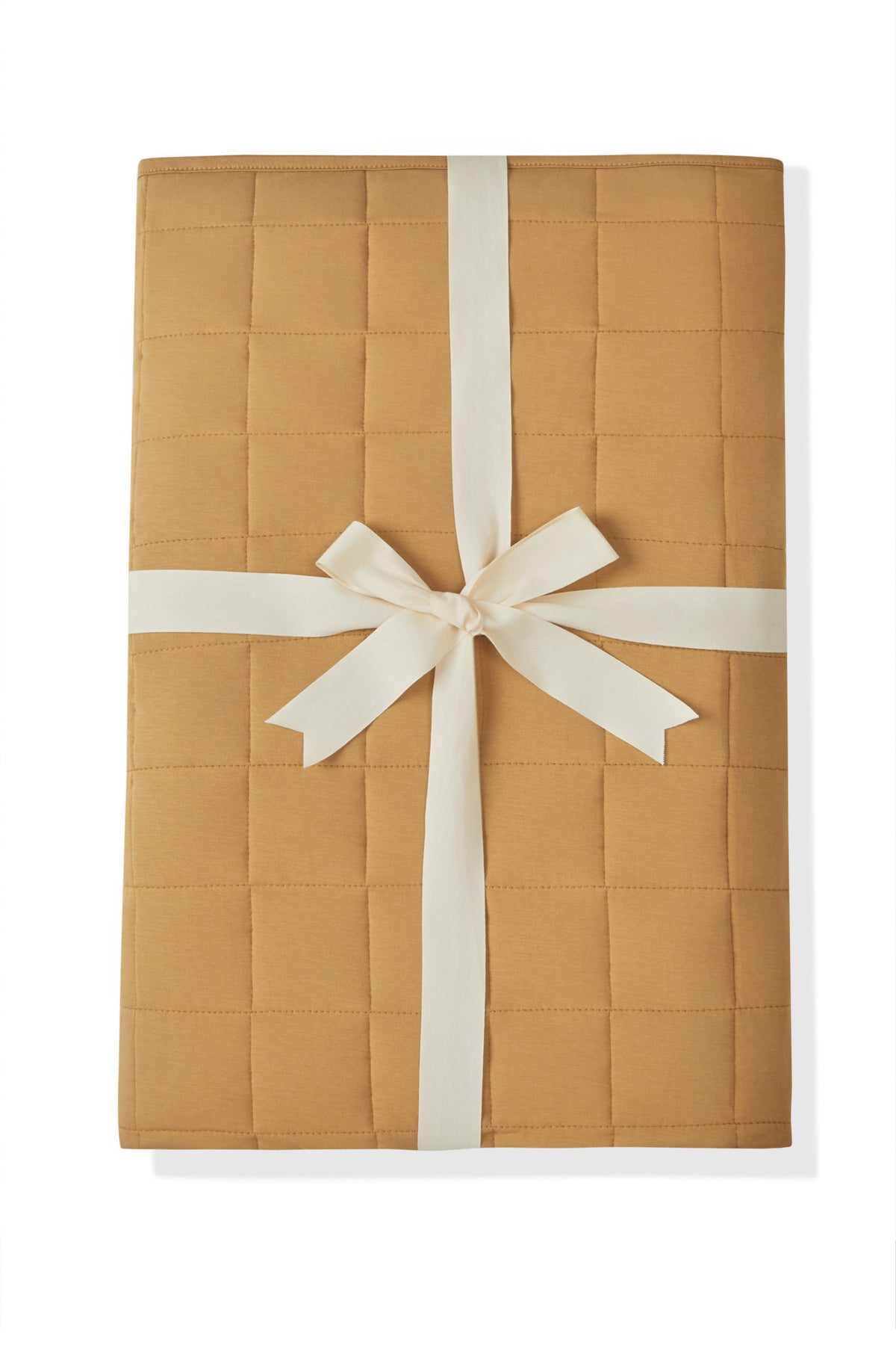 Adult Quilted Blanket in Ochre 2.5 packed with a ribbon on a white background