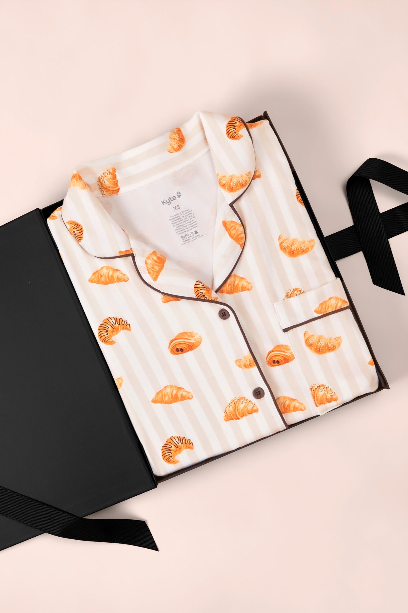 Long-Sleeved Women's Pajama Set in Croissant print on a a white background