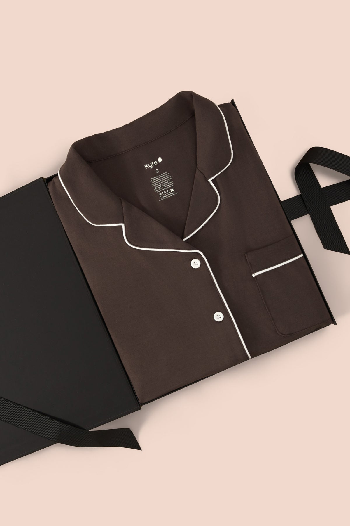 Long-Sleeved Women's Pajama Set in Espresso with Cloud Trim packed in a box on a beige background