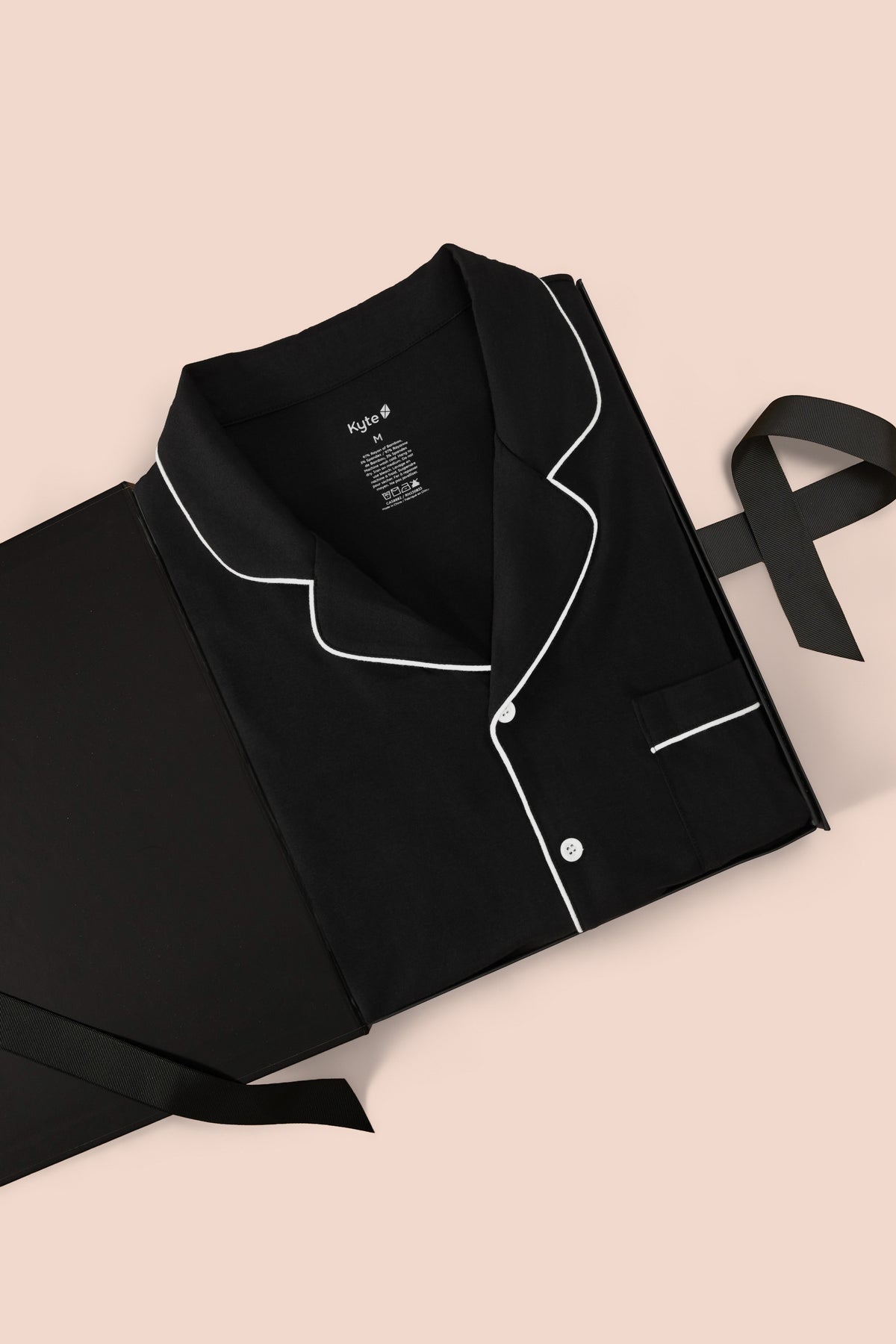 Men's Long Sleeve Pajama Set in Midnight packed in a box on a beige background
