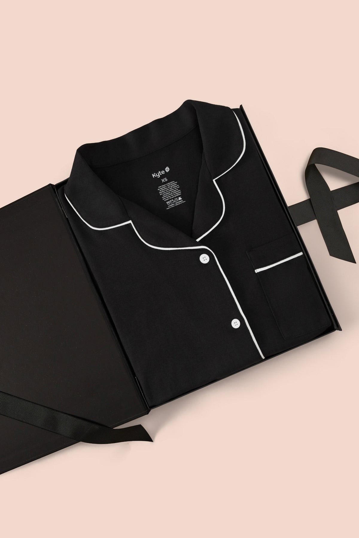 Women's Short Sleeve Cropped Pajama Set in Midnight packed in a box on a beige background