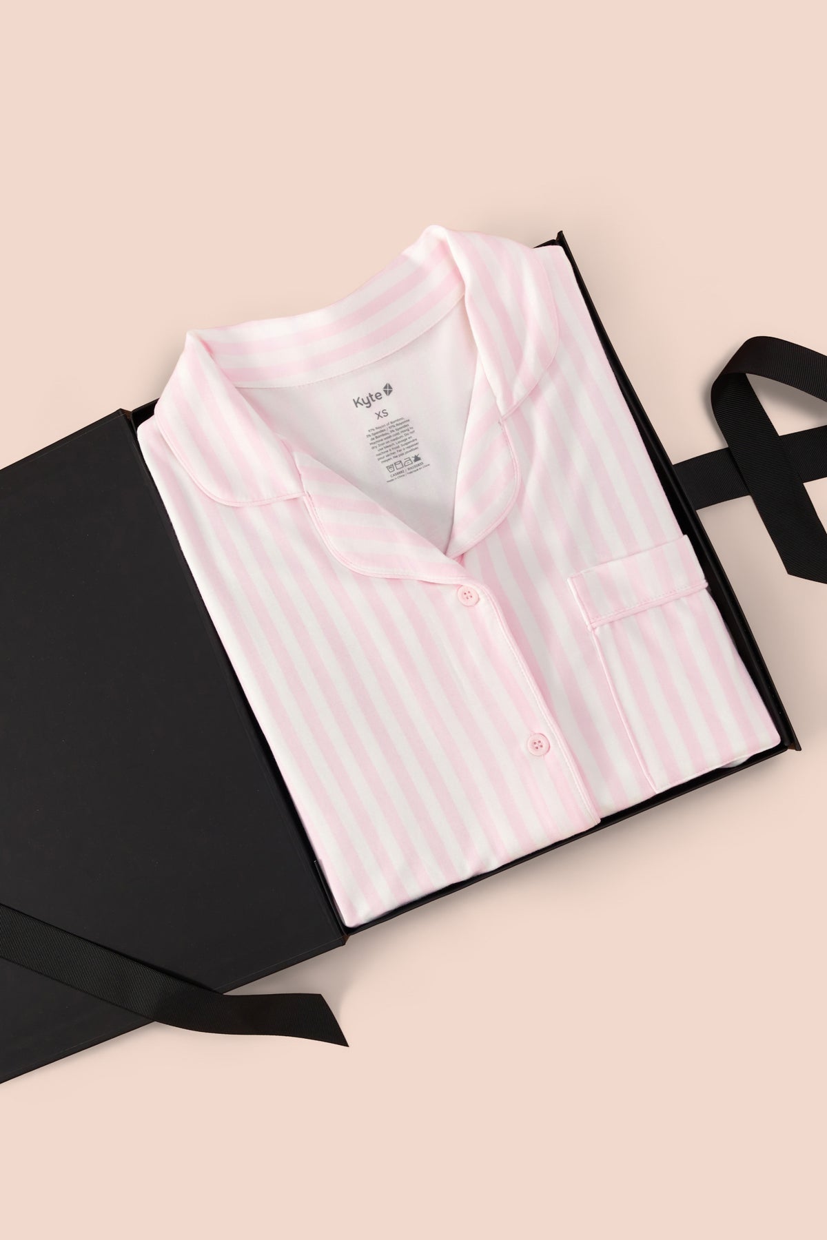 Long-Sleeved Women's Pajama Set in Small Sakura Stripe print packed in a box on a beige background