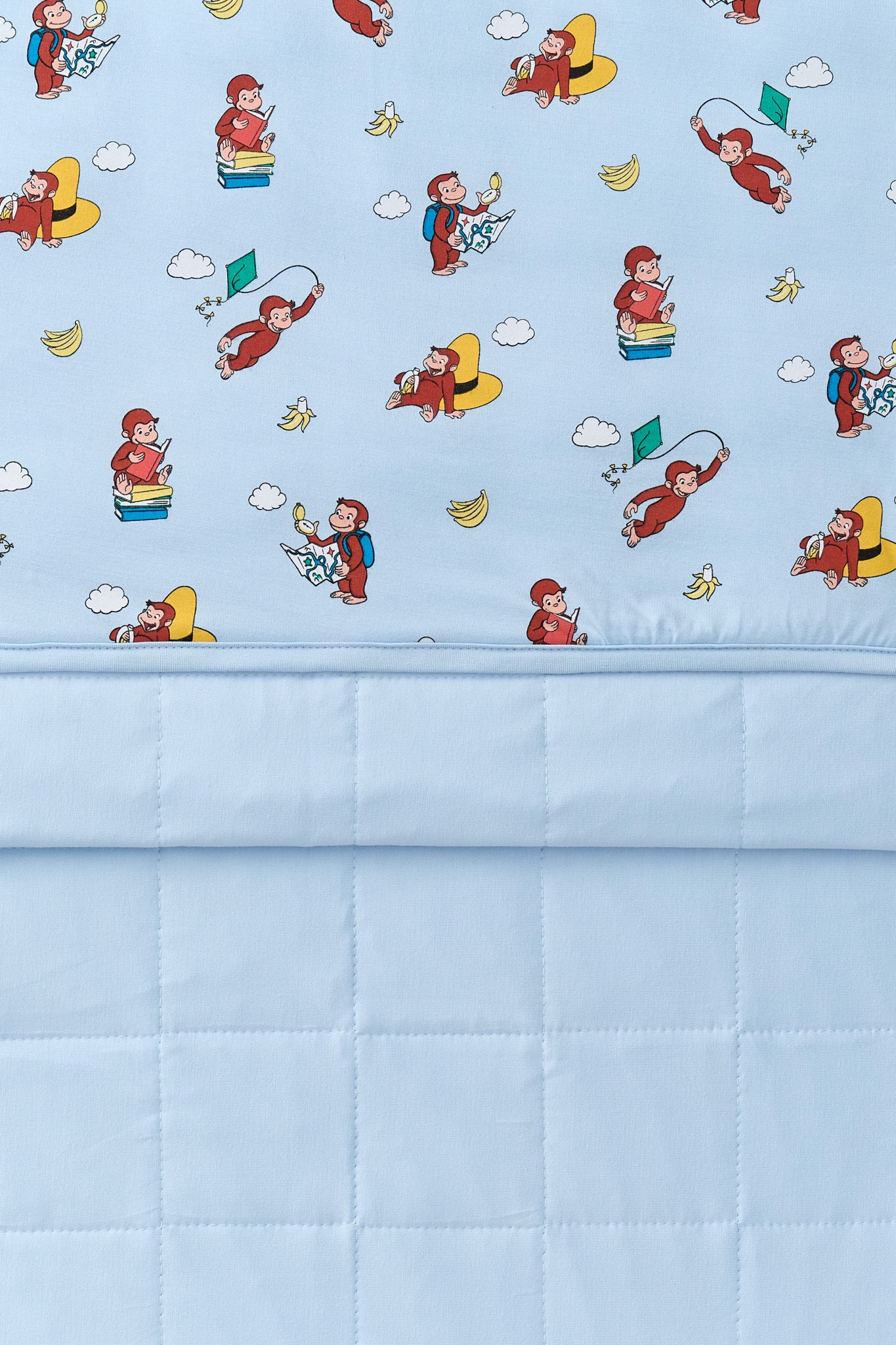 Front and back of Blue Youth Blanket in Curious George 2.5 print